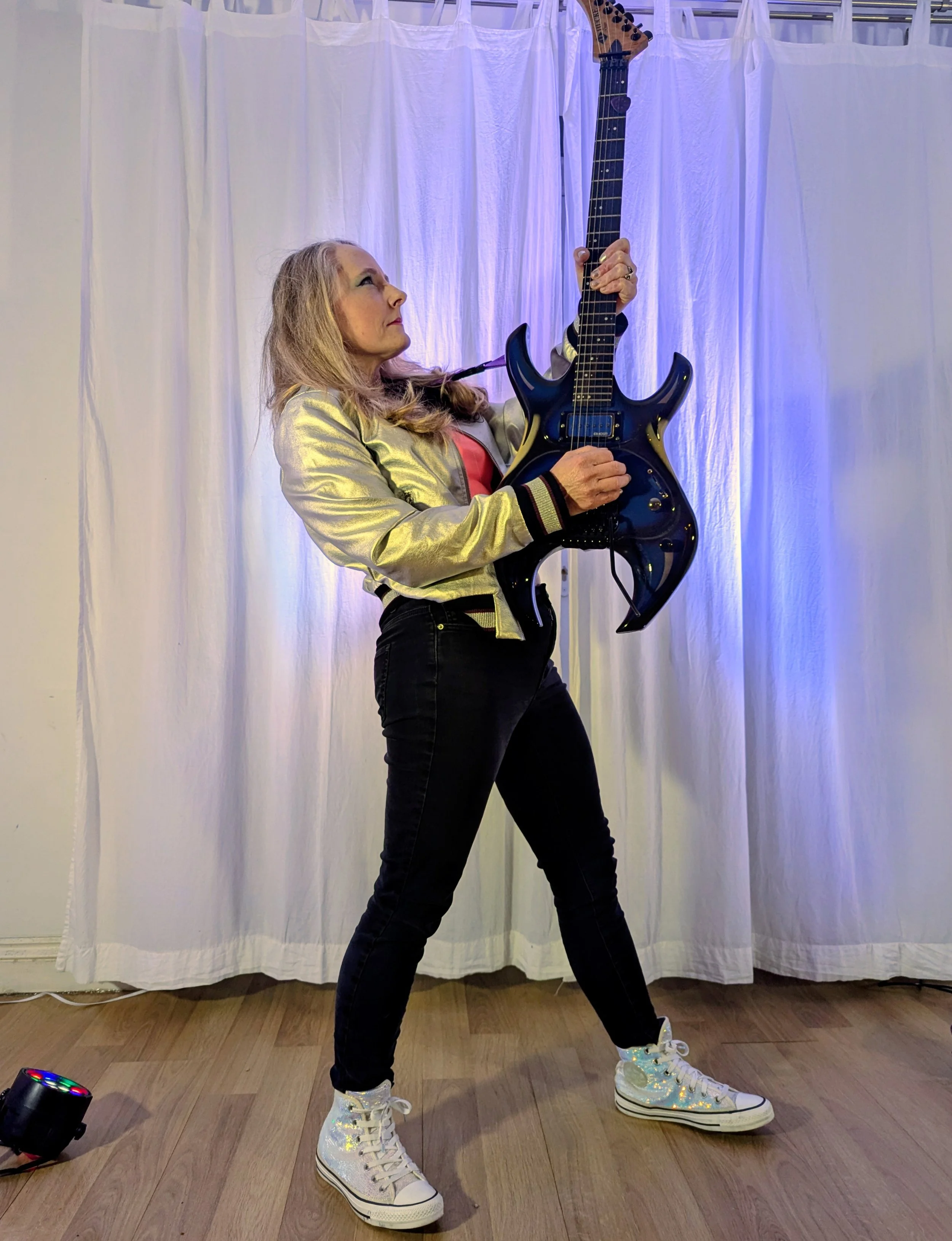 DAWN performing live guitar over DJ-style tracks for live entertainment.