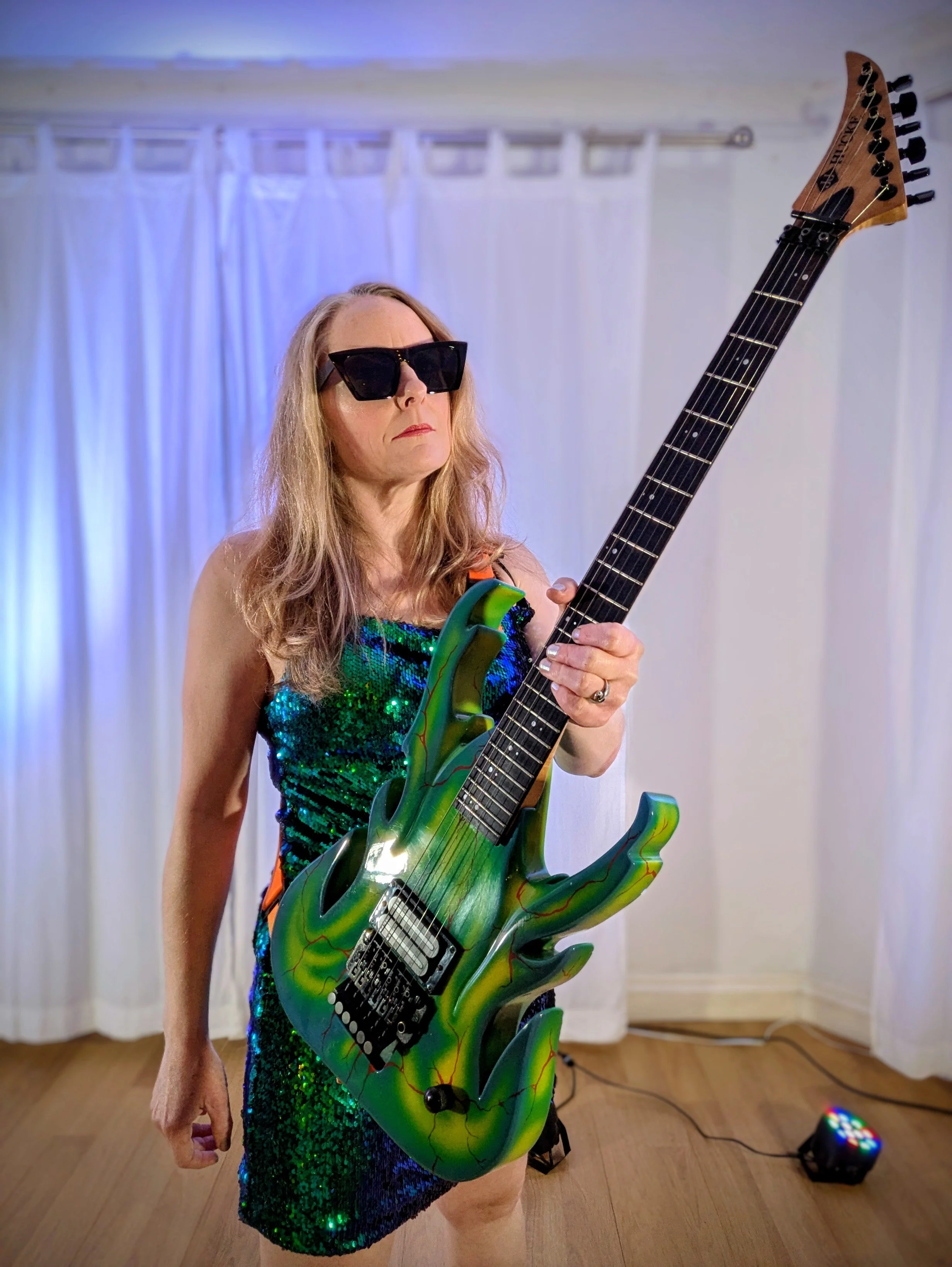 Promotional photo of DAWN live guitar performances over DJ sets.