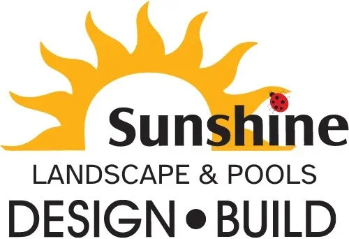 Logo for Sunshine Landscape & Pools featuring a sun with rays and a ladybug on the letter 'i' in 'Sunshine'