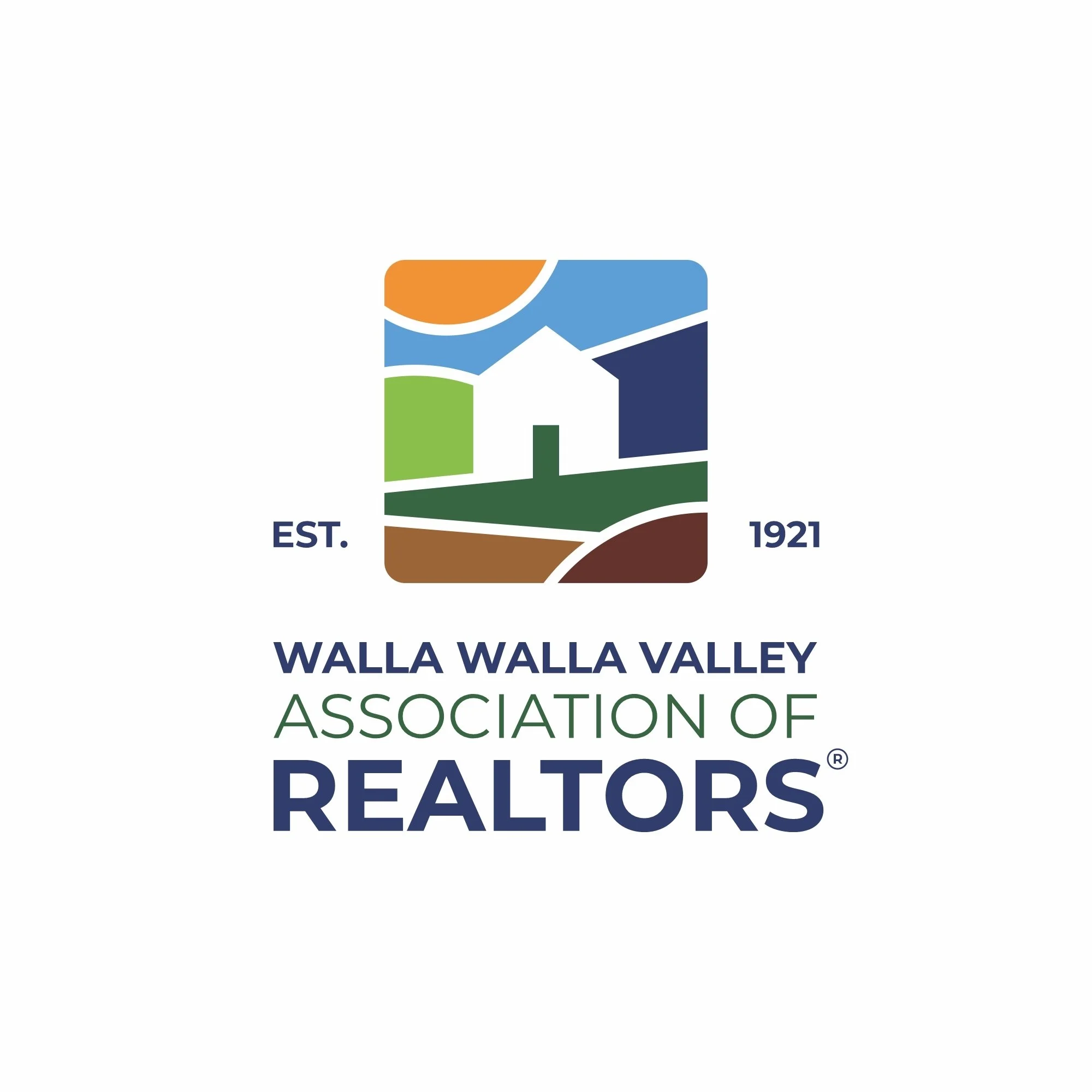 Logo of Walla Walla Valley Association of Realtors showing a stylized landscape with a house, mountains, and sky, with the text 'EST. 1921 Walla Walla Valley Realtors'.