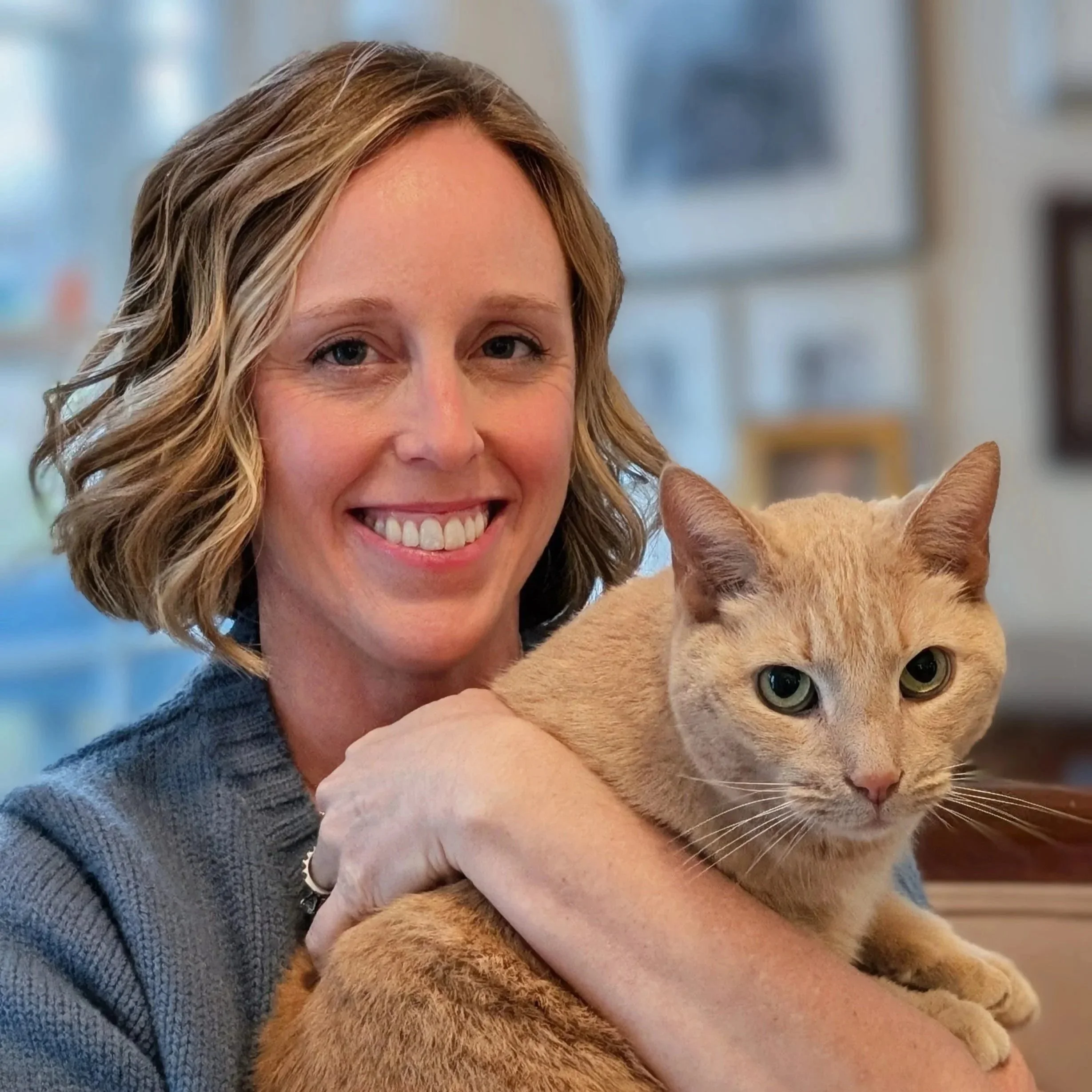 Michelle Osborne, illustrator for Wonder Together, holding her cat, Daniel, the inspiration for the cat in the book.