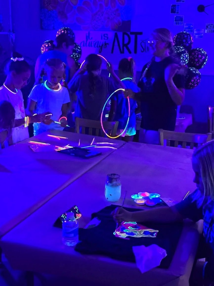 children playing with neon bracelets