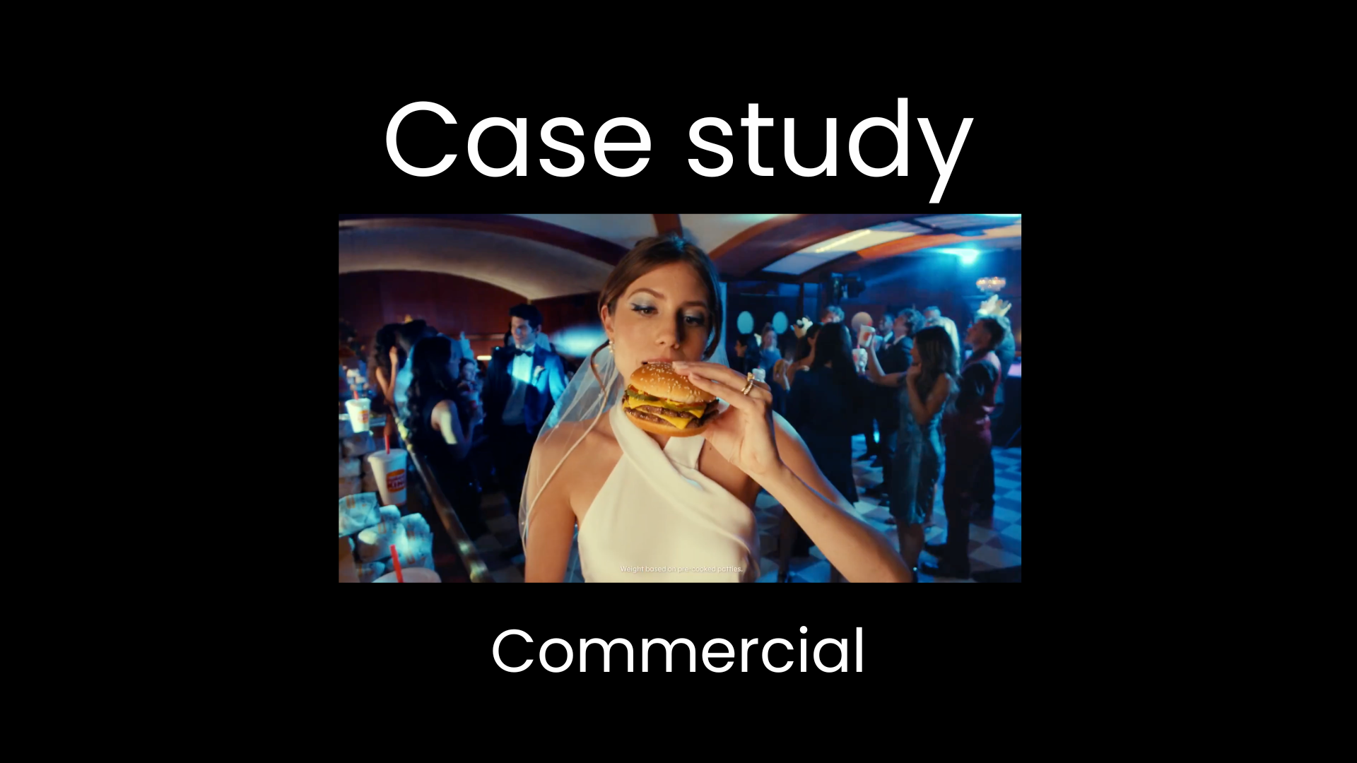Case study thumbnail for a television commercial project, showing a woman eating a burger at an event with ambient blue lighting