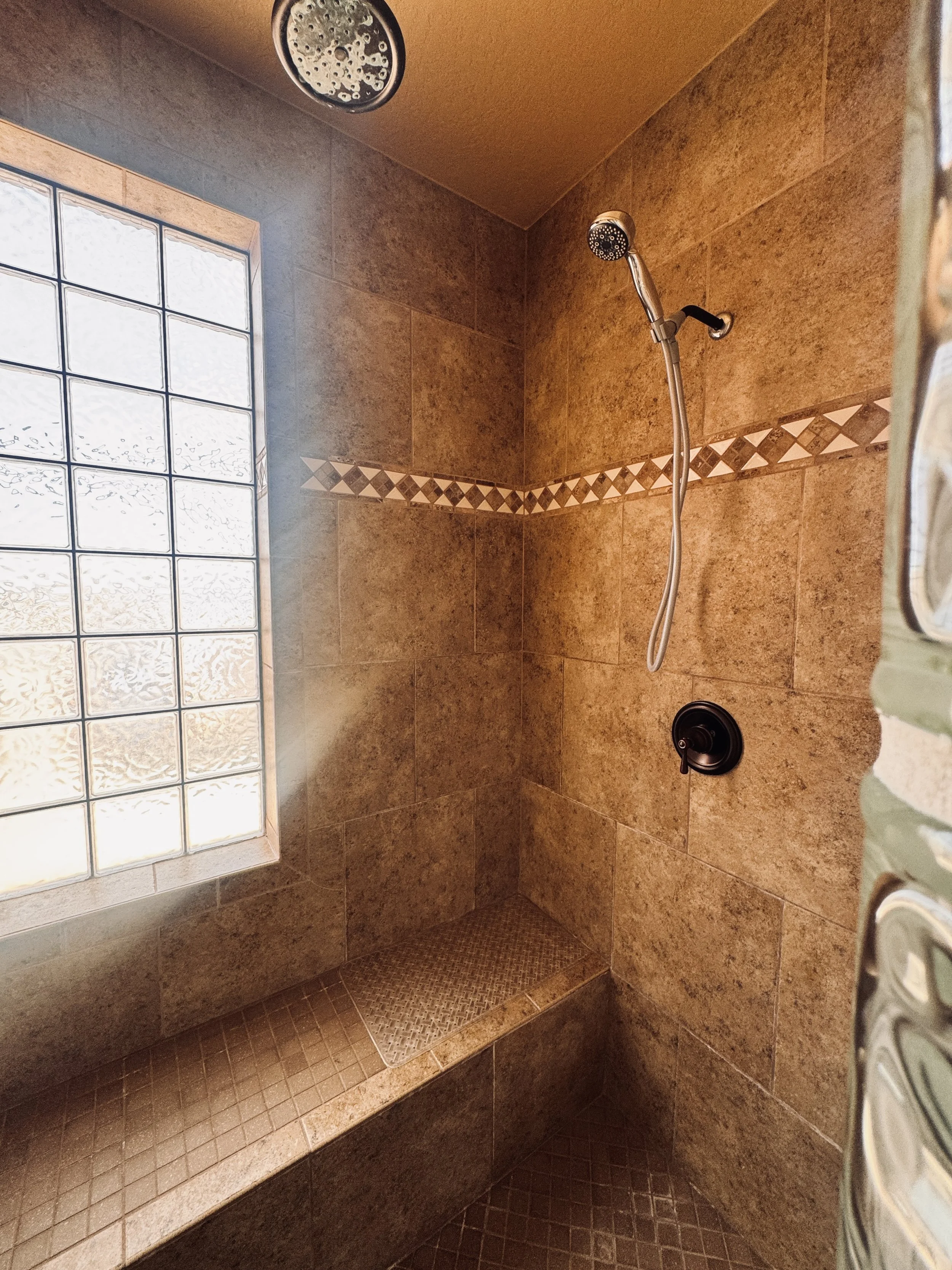Bathroom Renovation: Spa-inspired bathroom remodel in Bullhead City and Surrounding Areas featuring custom walk-in shower tile and advanced plumbing.