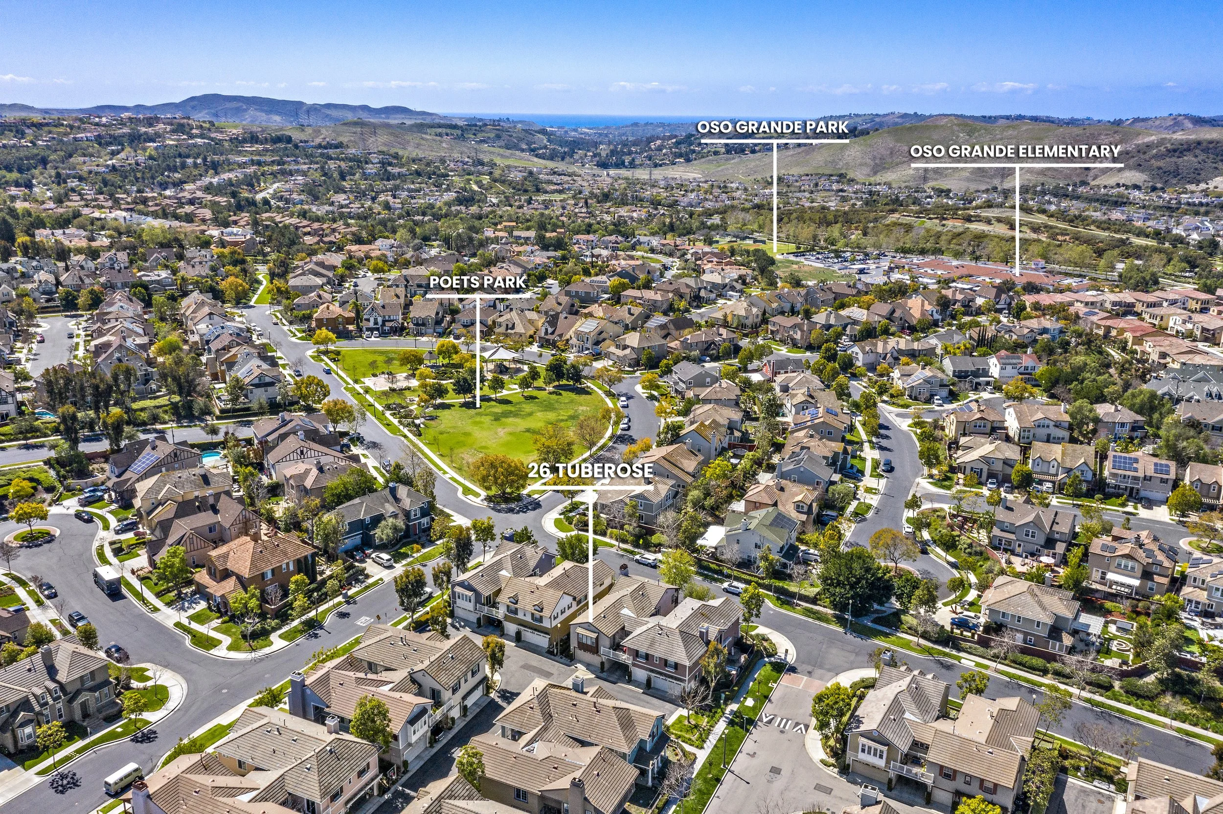 Aerial view of a suburban neighborhood with labeled parks and landmarks, including Poets Park, 26 Tuberose, Osos Grande Elementary, and Osos Grande Park.