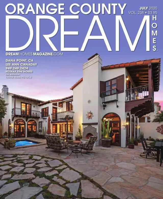 Cover of Orange County Dream Homes magazine, July 2020 issue, featuring a Spanish-style house with a courtyard, swimming pool, and outdoor seating.