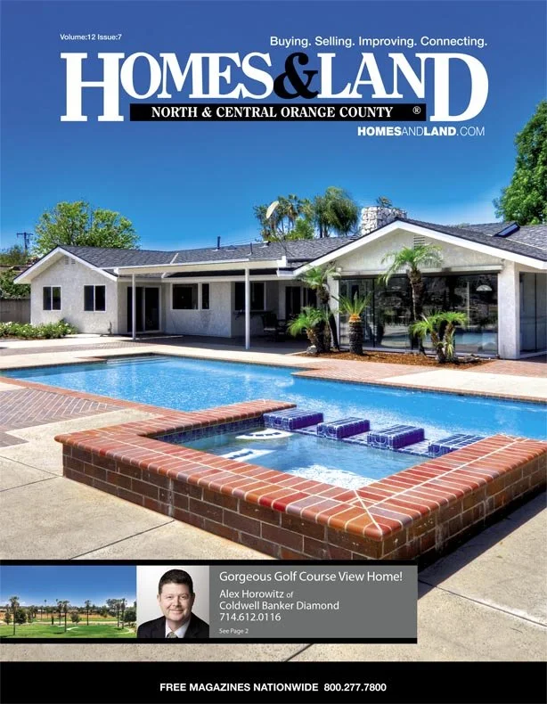 Cover of Homes & Land magazine featuring a modern house with a swimming pool in the backyard, palm trees, and a promotional section for a golf course view home.