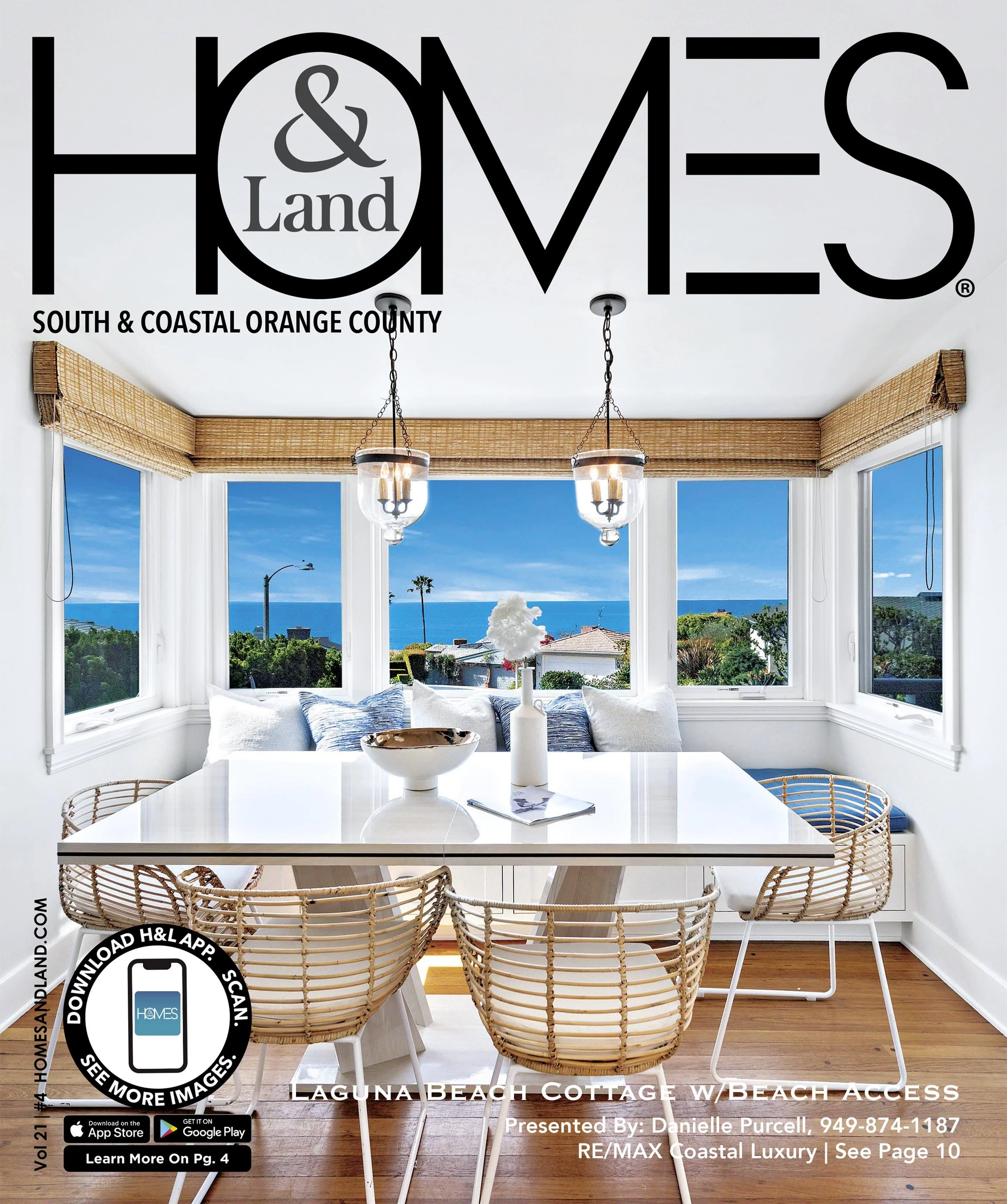 Interior view of a coastal cottage dining area with large windows, a white table, woven chairs, and a view of the beach and ocean outside.