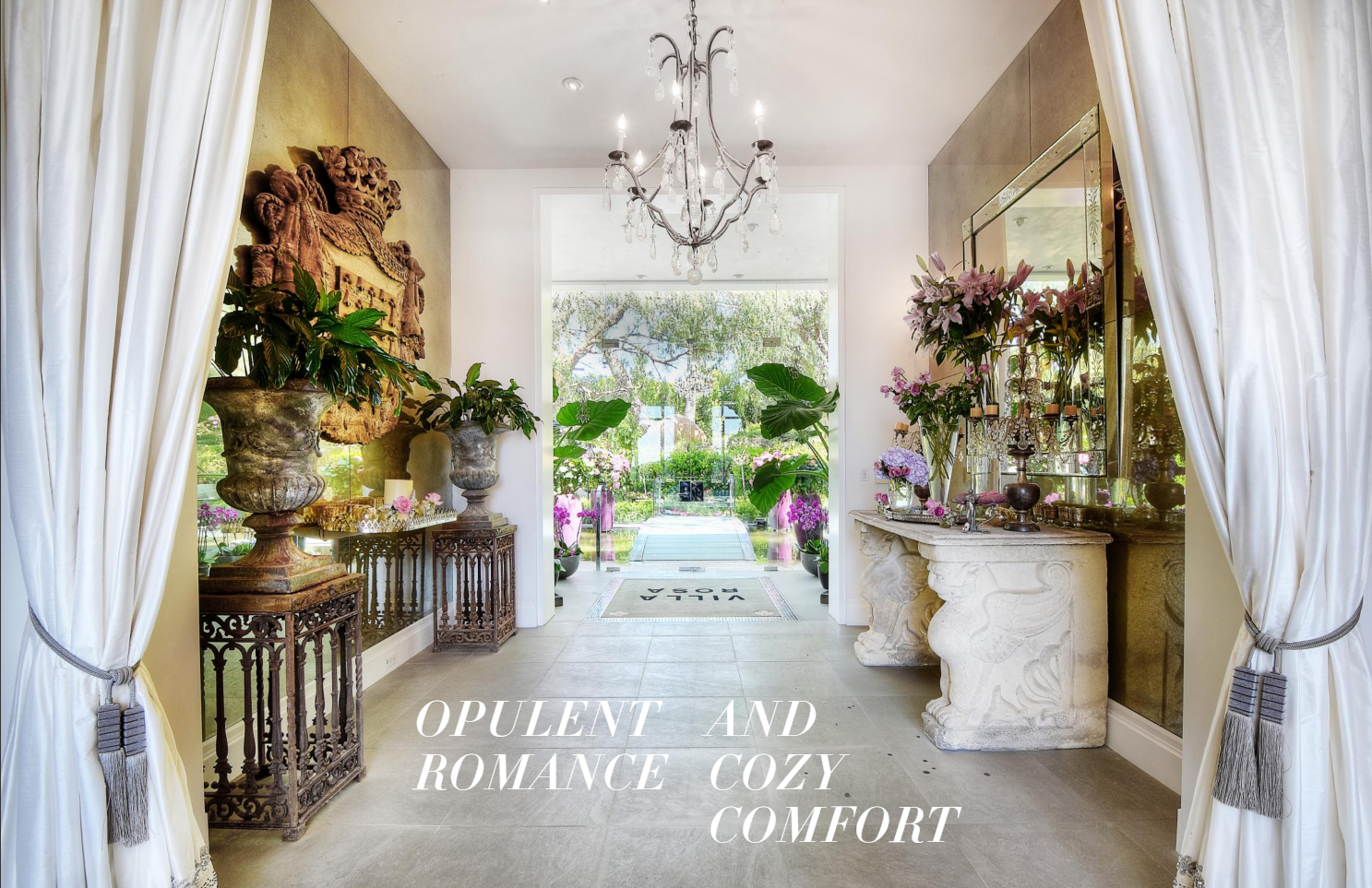 Elegant foyer with large glass doors opening to a garden, decorated with potted plants and flowers, ornate stone and metal furnishings, a chandelier, and white curtains. Text overlay reads "Opulent and Romance Cozy Comfort."