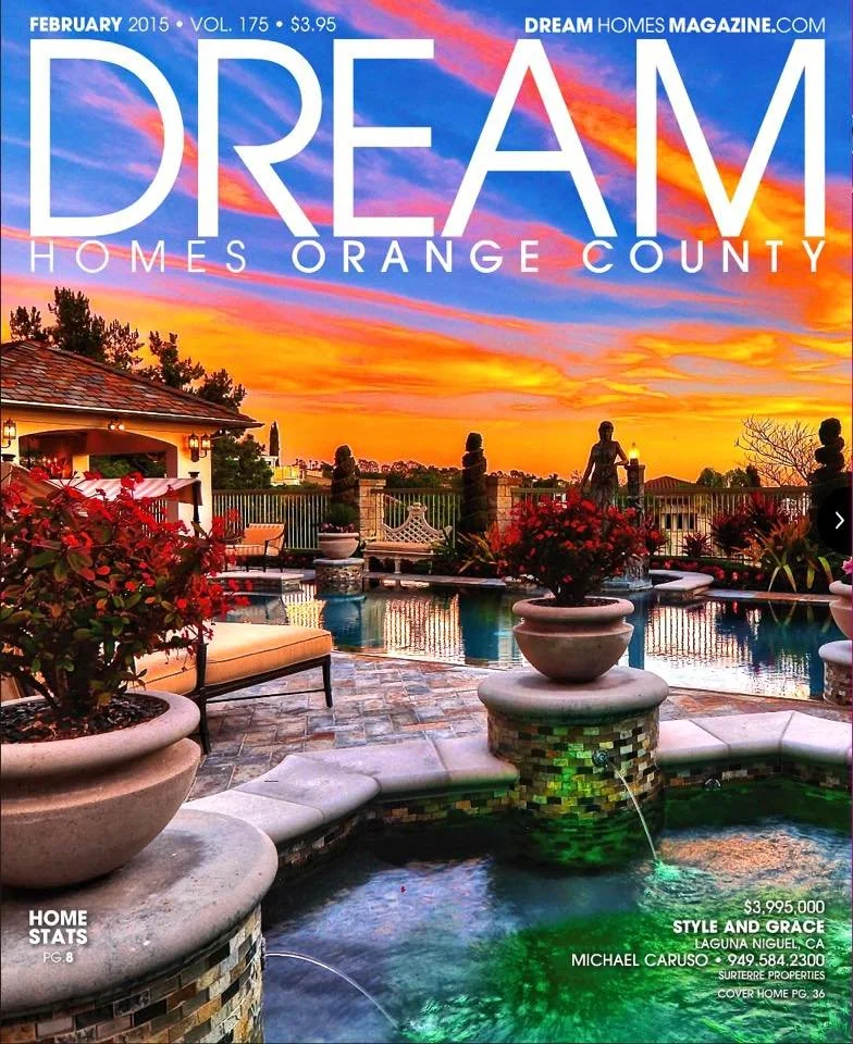 Colorful sunset over a luxurious backyard with a swimming pool, potted plants, statues, and outdoor furniture.