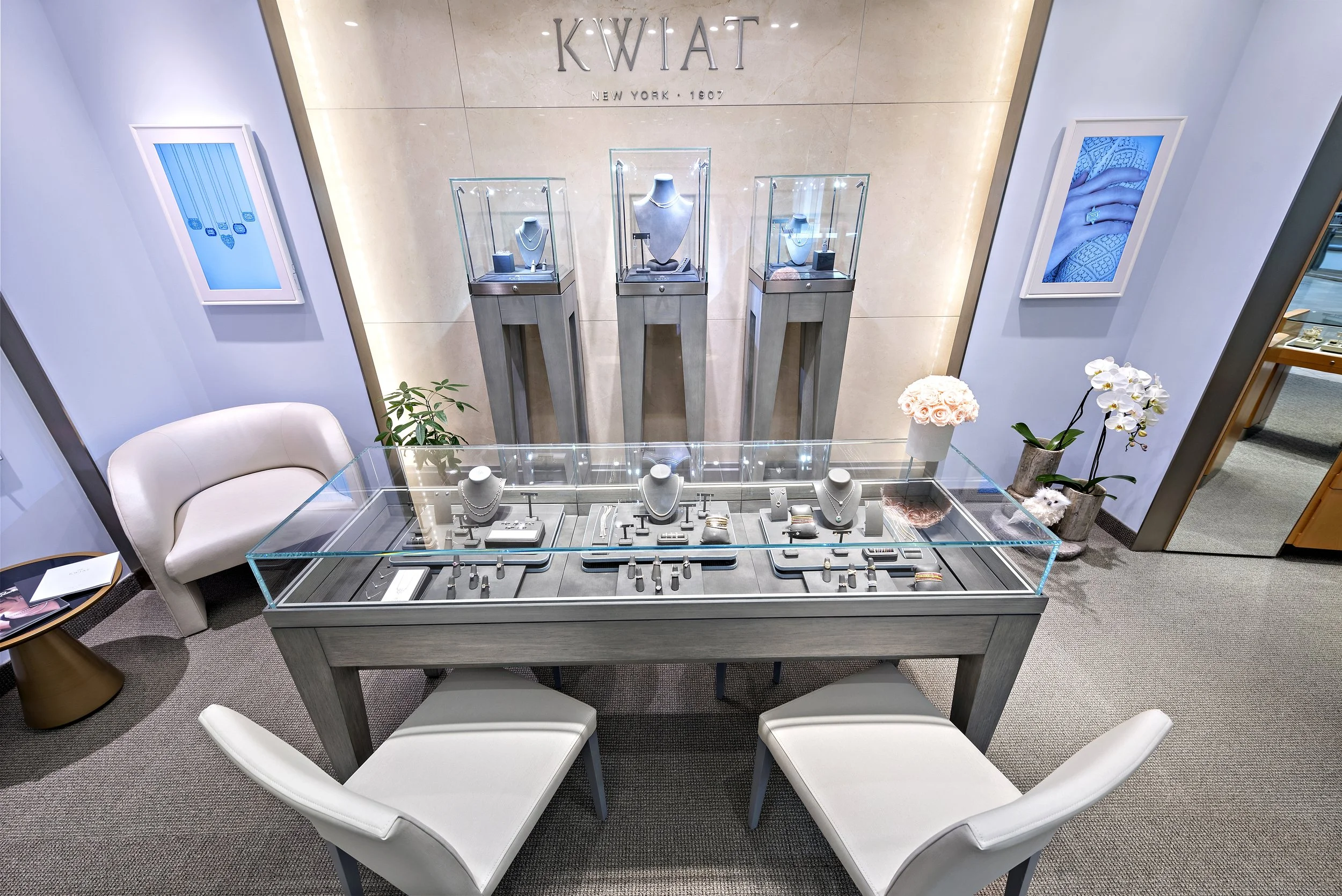 Jewelry display case with necklaces, rings, and bracelets in a jewelry store.