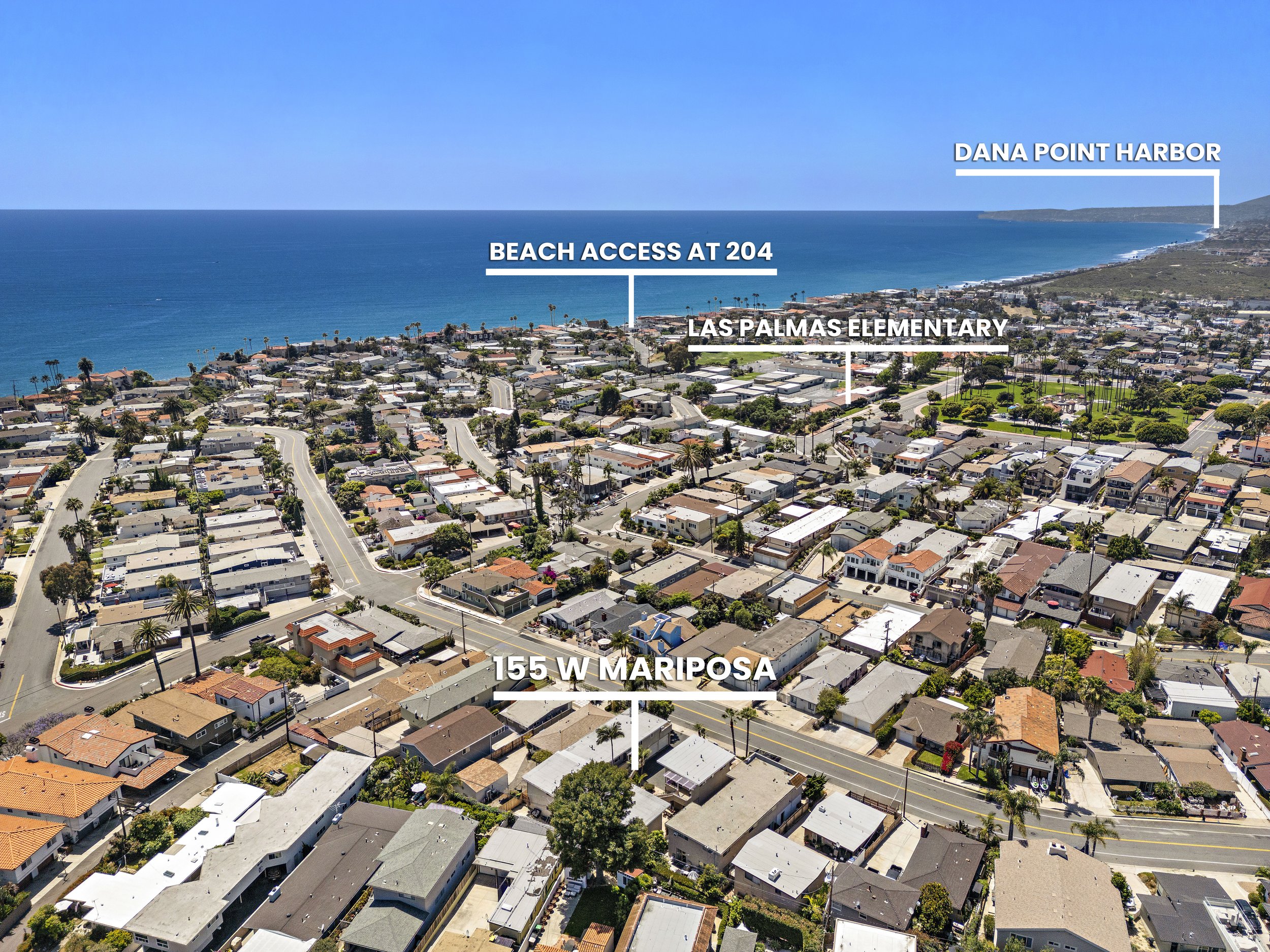 Aerial view of a coastal neighborhood with labels indicating Las Palmas Elementary School, beach access at 204, Dana Point Harbor, and the address 155 W Mariposa, showing houses, streets, and the ocean in the background.