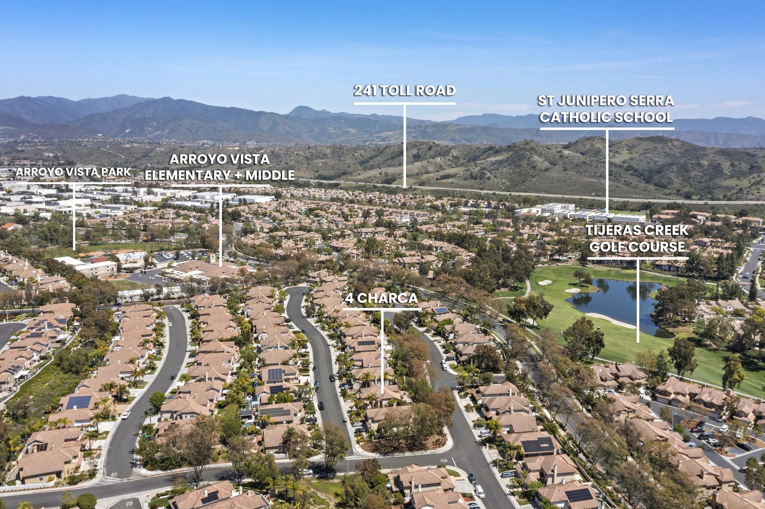 Aerial view of a residential neighborhood with labels identifying local landmarks such as Arroyo Vista Elementary and Middle School, Arroyo Vista Park, 241 Toll Road, Tijeraso Creek Golf Course, and 4 Charca, with mountains in the background under a 