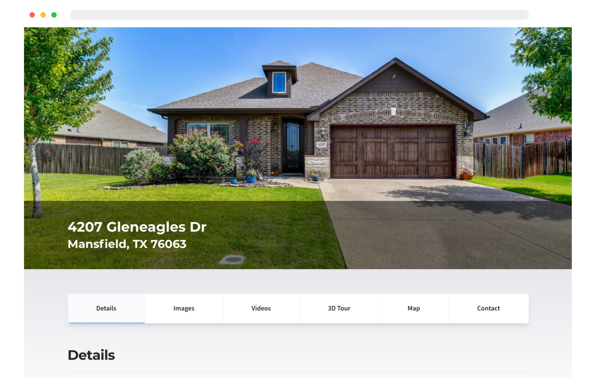 A house with brown brick exterior, a brown garage door, a small dormer window, and a front yard with green grass, plants, and flowering bushes, under a clear blue sky.