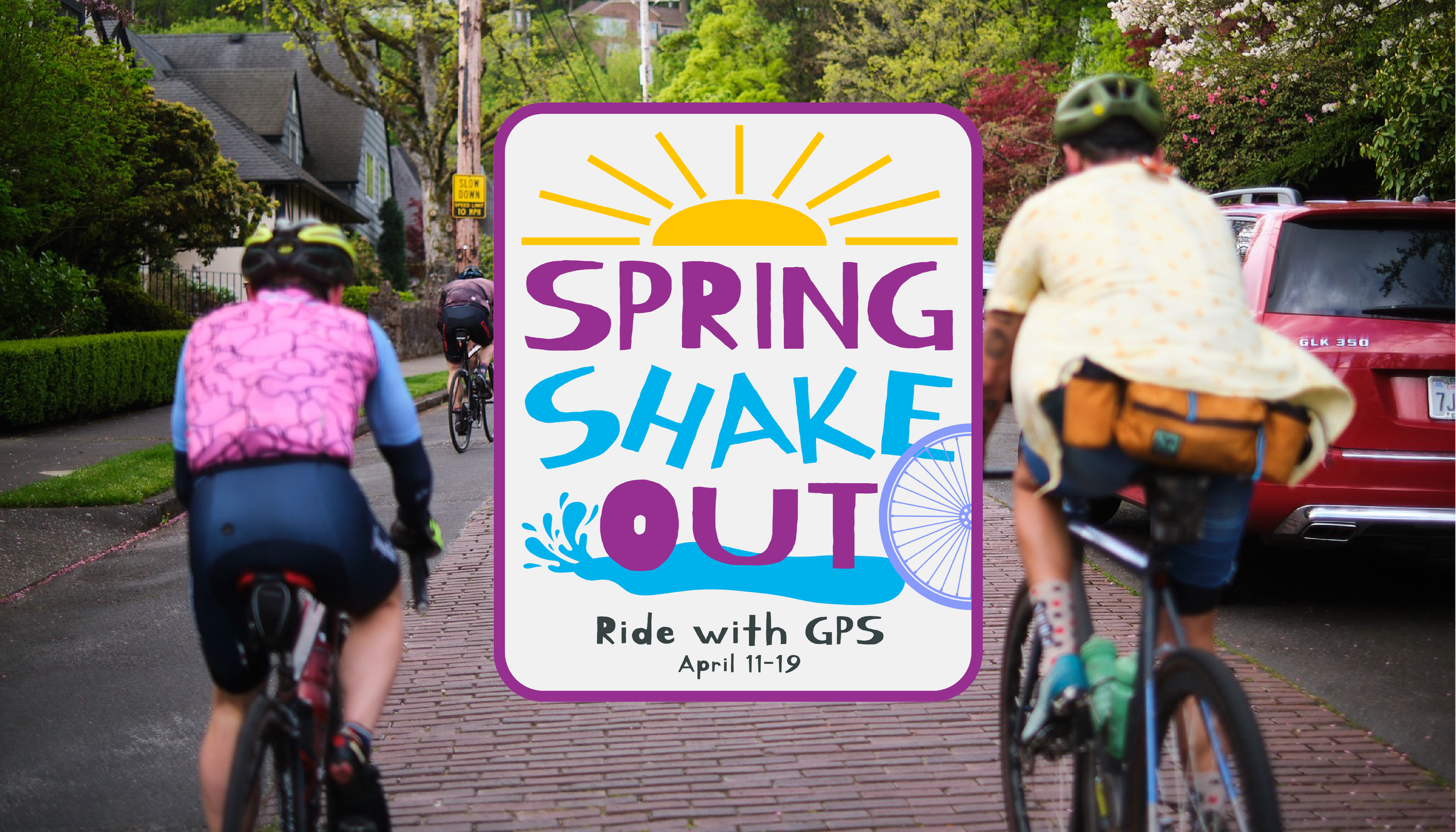 Three cyclists riding away from the camera down a brick-paved street lined with spring-blooming trees, overlaid with the Spring Shakeout event logo reading "Ride with GPS, April 11–19.