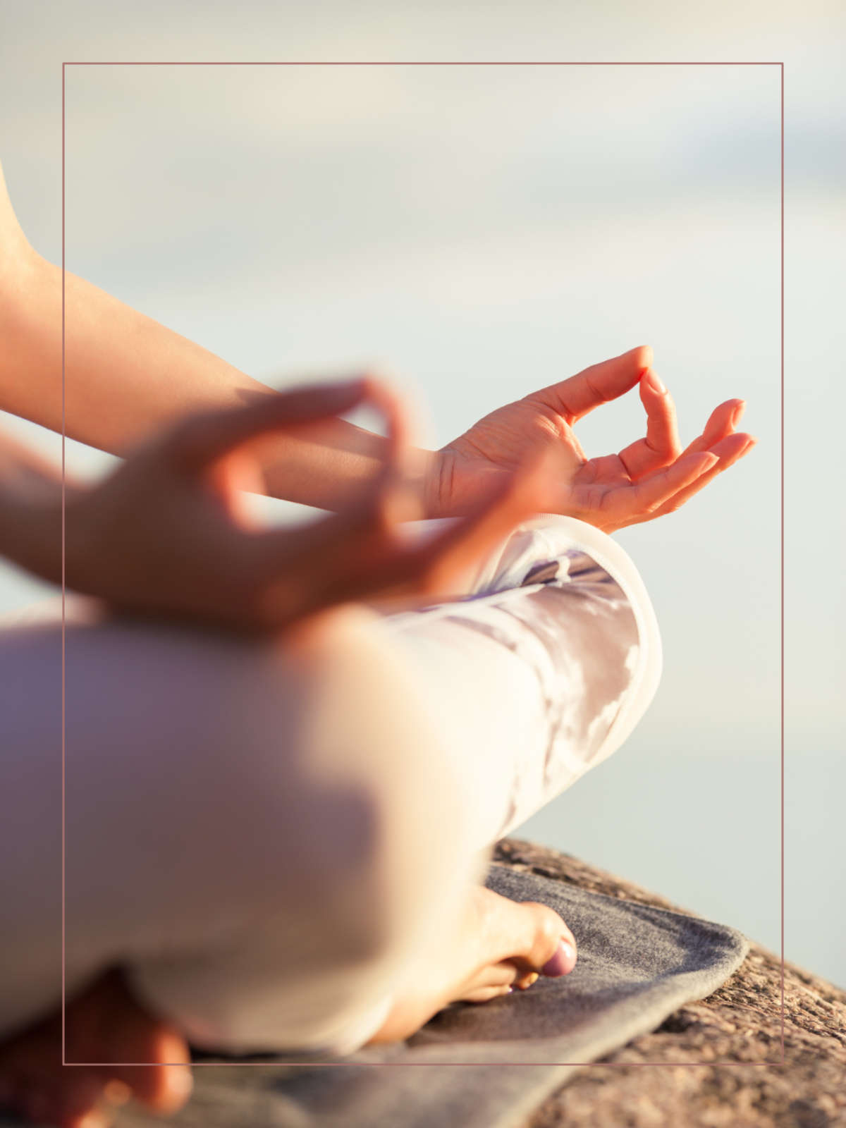 Woman meditating cross-legged with her hands resting on her knees