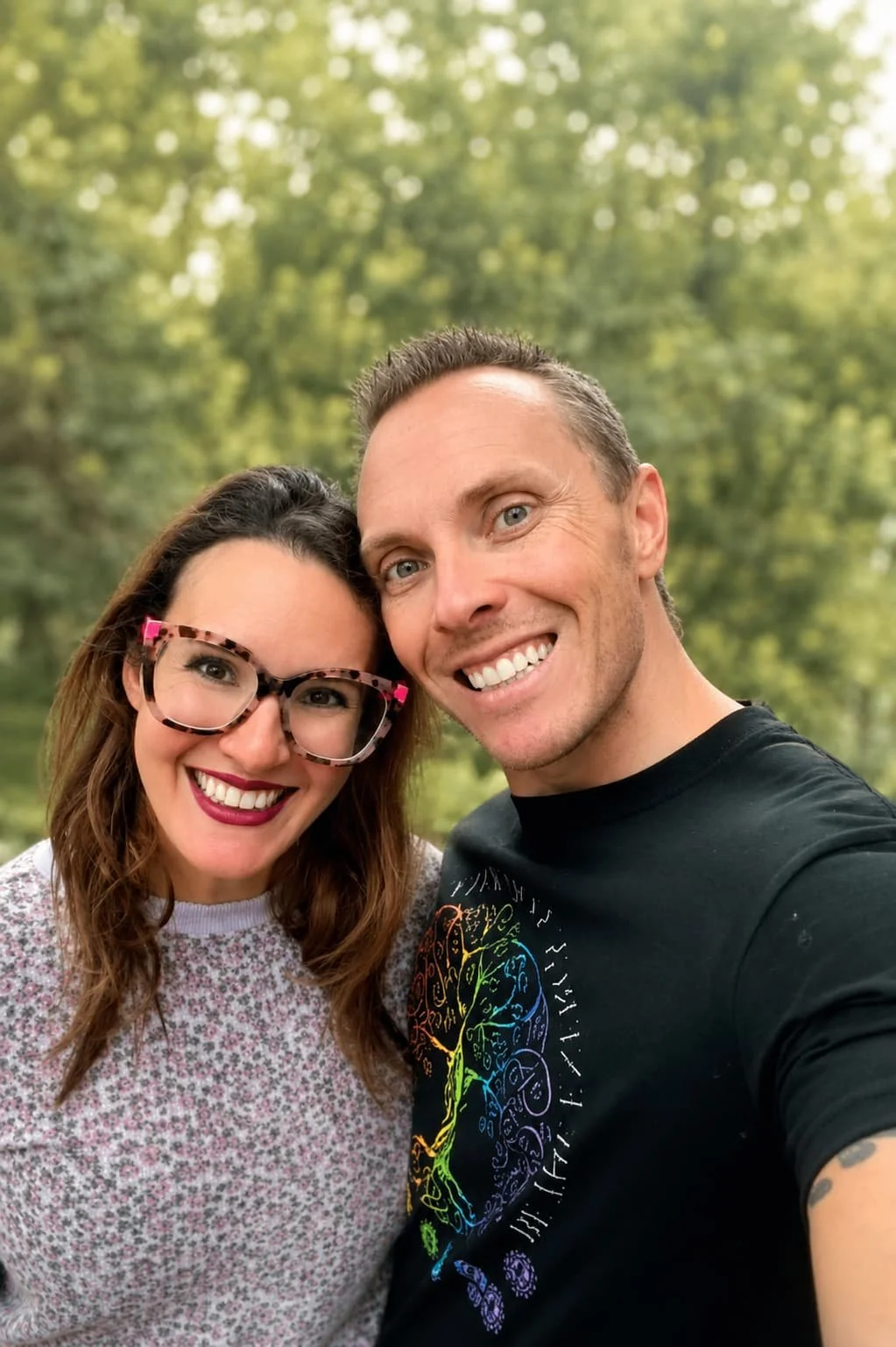 Tieterious and Seraphina Skye smiling together outdoors, real married couple and founders of Entwined Breath conscious couples experiences in Cary NC