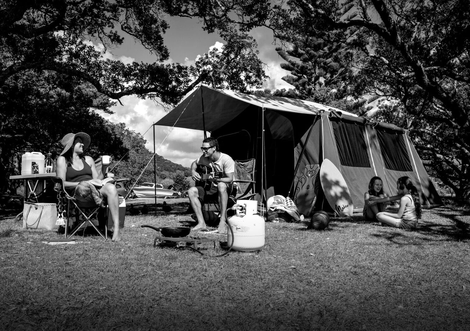 Family camping in New Zealand with a gas bottle and cooker