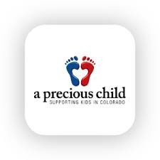 A Precious Child logo - two footprints with arches making a heart shape
