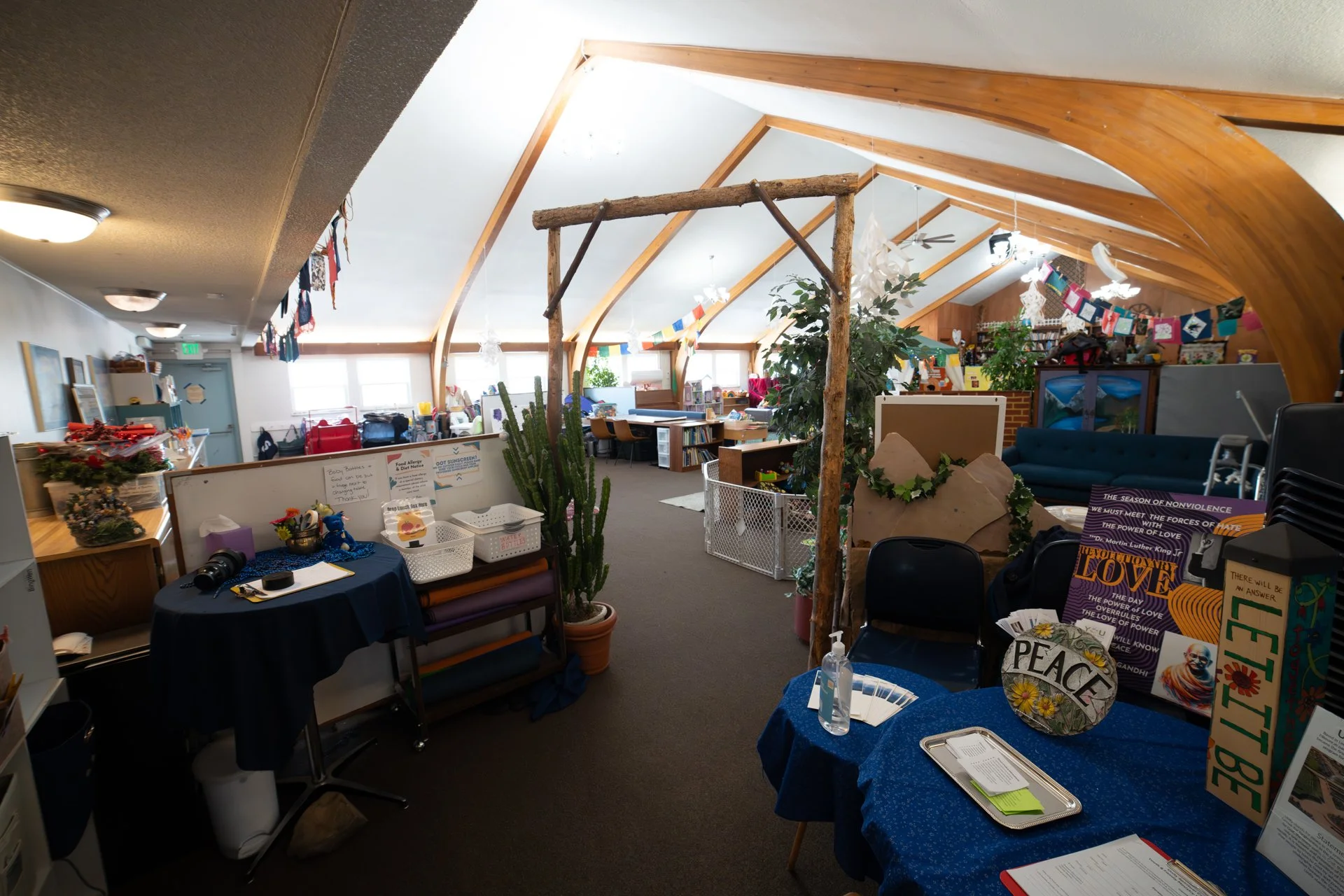 Large room with vaulted ceilings, lots of colors, kids toys, and bright lights