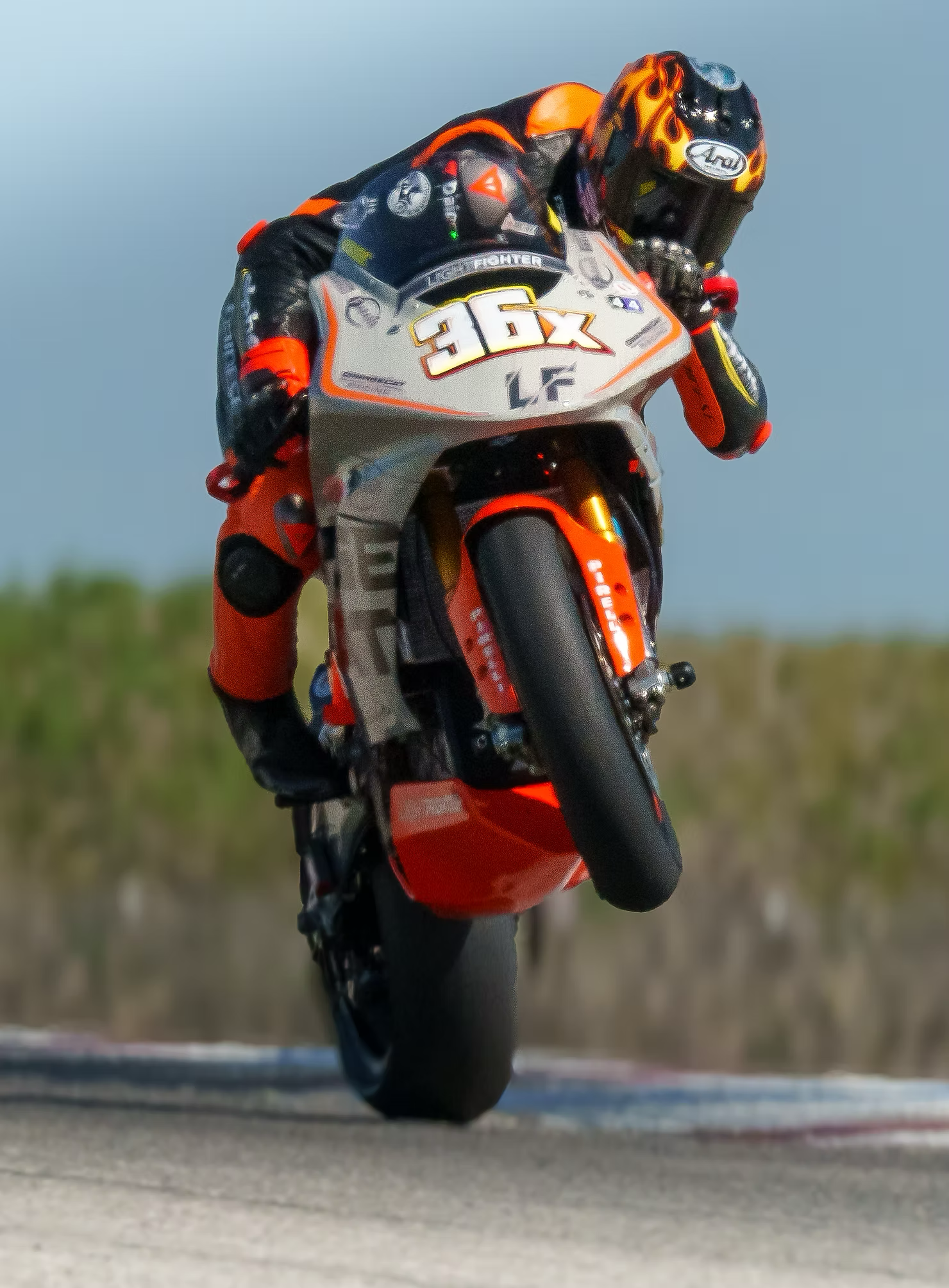 Jayson Uribe riding Lightfighter V3 over the wheelie hill at Buttonwillow, setting a new EV moto lap record and winning Middleweight Superbike and Formula 1 Open Superbike.