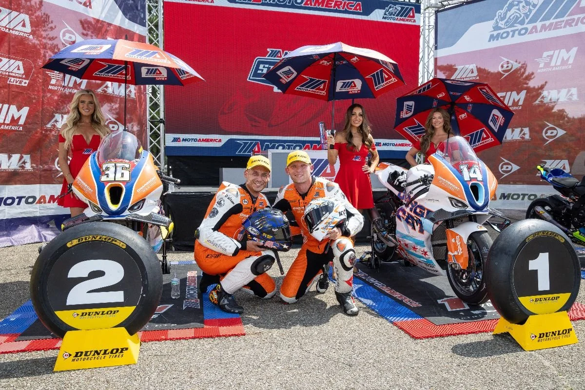 OrangeCat Racing riders Jayson Uribe (left) and Andrew Lee pose in winner's circle at Mid-Ohio Sports Car Course on Sunday after securing a 1-2 finish in the day's MotoAmerica Stock 1000 race.