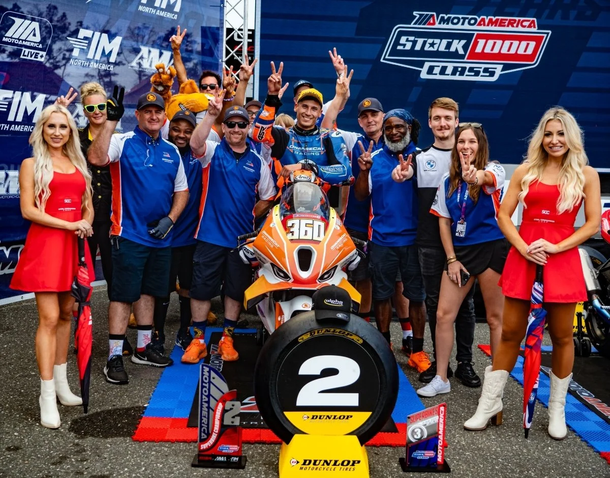 Jayson Uribe on the podium with OrangeCat Racing at New Jersey Motorsports Park, celebrating second place in the 2024 MotoAmerica Stock 1000 Championship