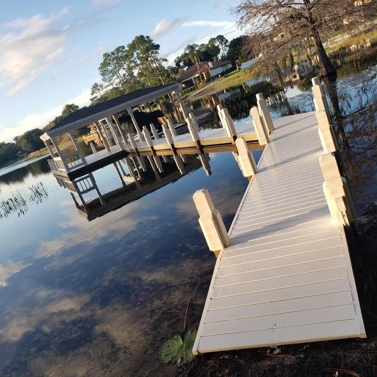 From raw framing over the water to a finished lakefront dock built to last. 

This custom dock and covered boat slip project completely transformed the waterfront access for this property, creating a clean, durable, and functional outdoor space desig
