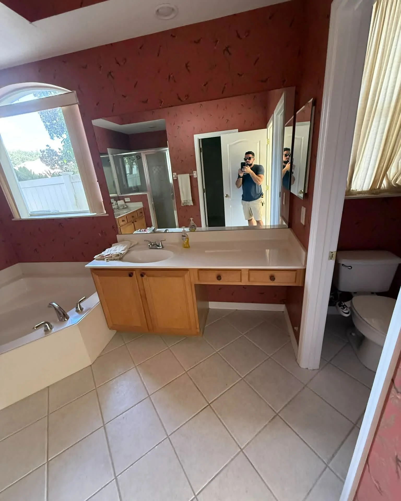 From dated finishes and an enclosed shower to a bright, modern retreat.

This master bathroom remodel completely transformed the space with a custom double vanity, oversized walk-in shower, marble-look tile, matte black fixtures, and thoughtful detai