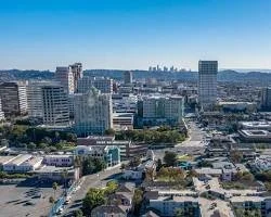 A city skyline with tall buildings under a clear blue sky