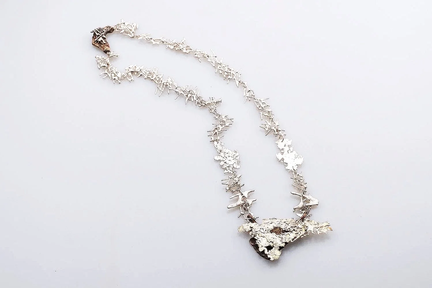 Secrets I Fine Silver, Bronze and Amethyst Stone (24” x 3.75”) 