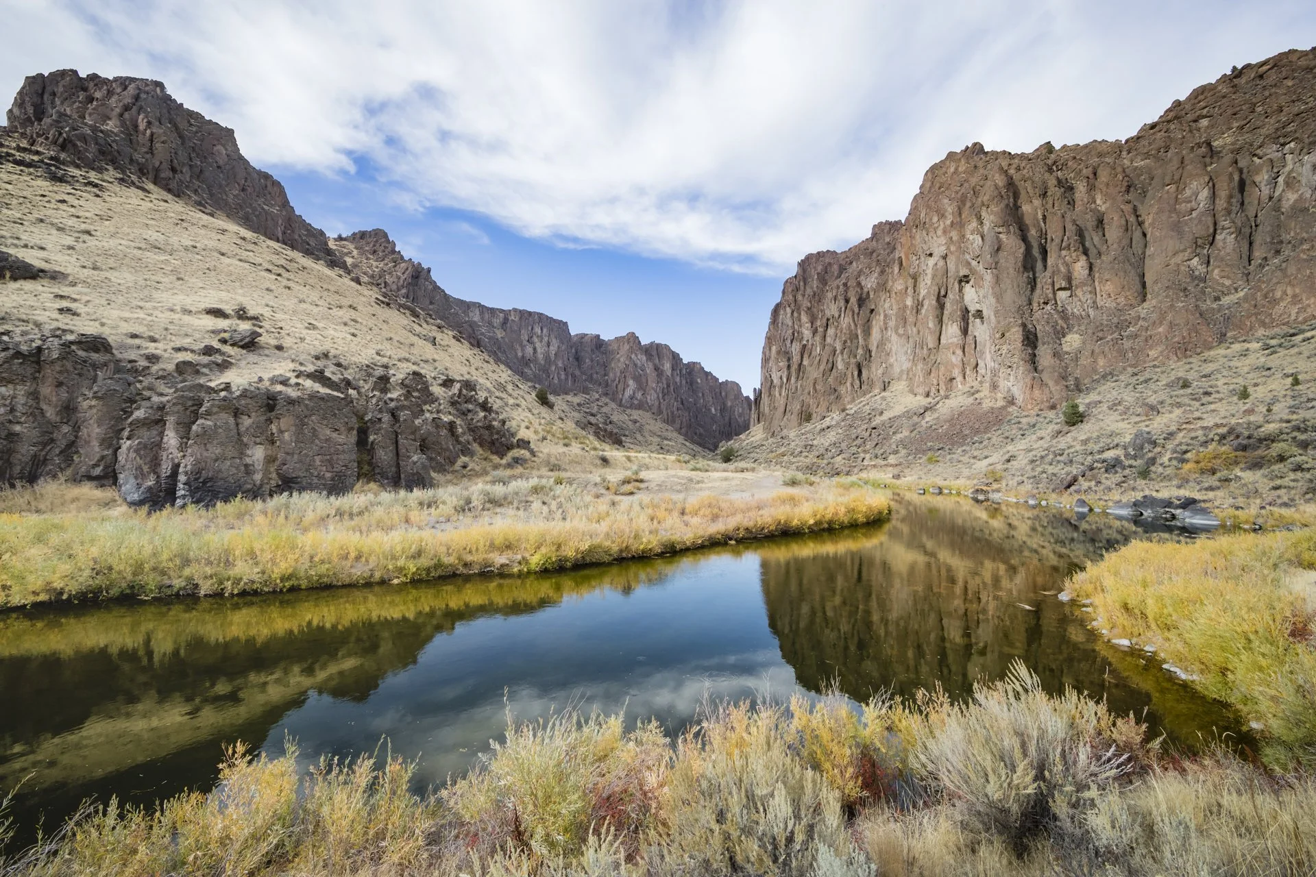 Landscape of a canyon and river reflection in the Owyhee Canyonlands featured in the Golden film, photographed by Fieldborn Creative.