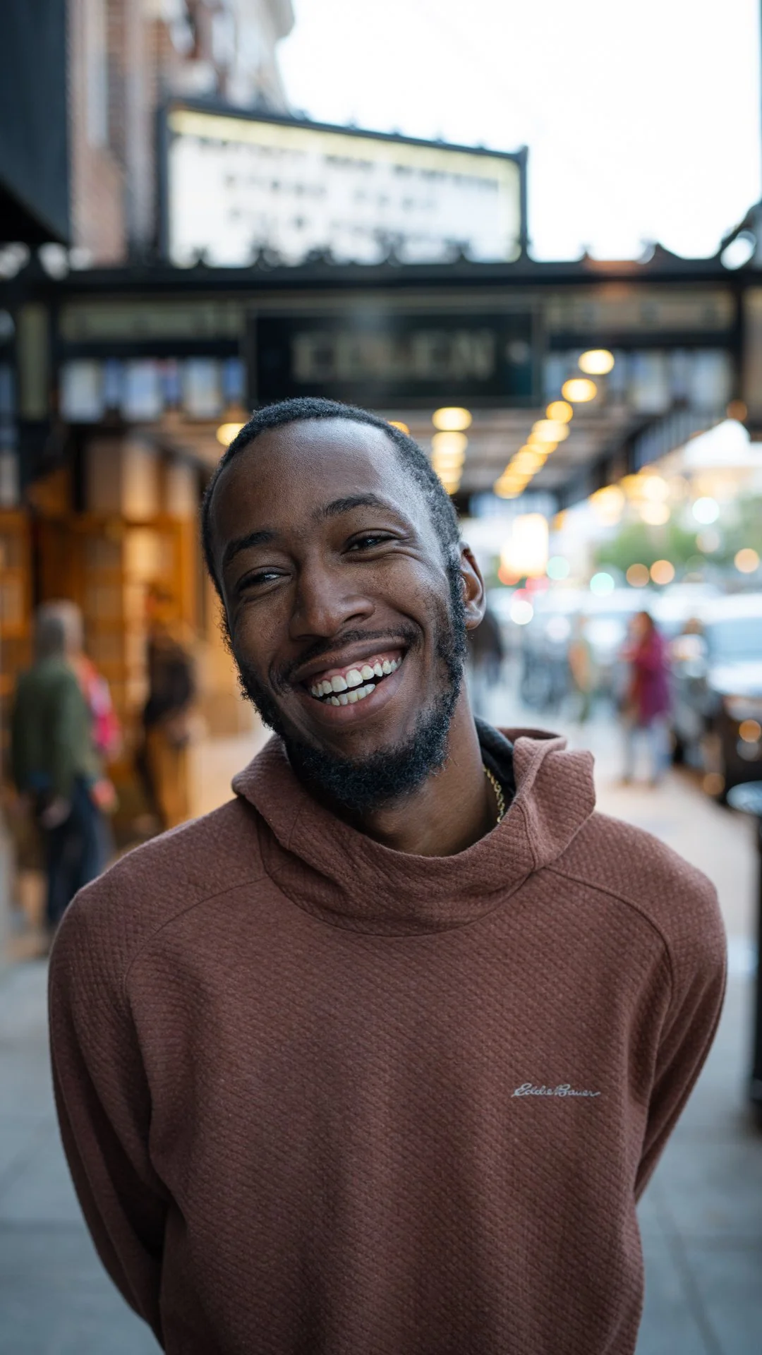 Portrait of Eeland Stribling standing outside the theater at Protect Our Winters StokeFest film release in Bozeman, Montana, photographed by Jake Burchmore.