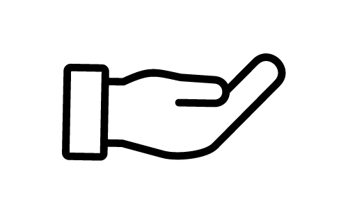 Een persoon die op een gitaar speelt in een donkere ruimte.