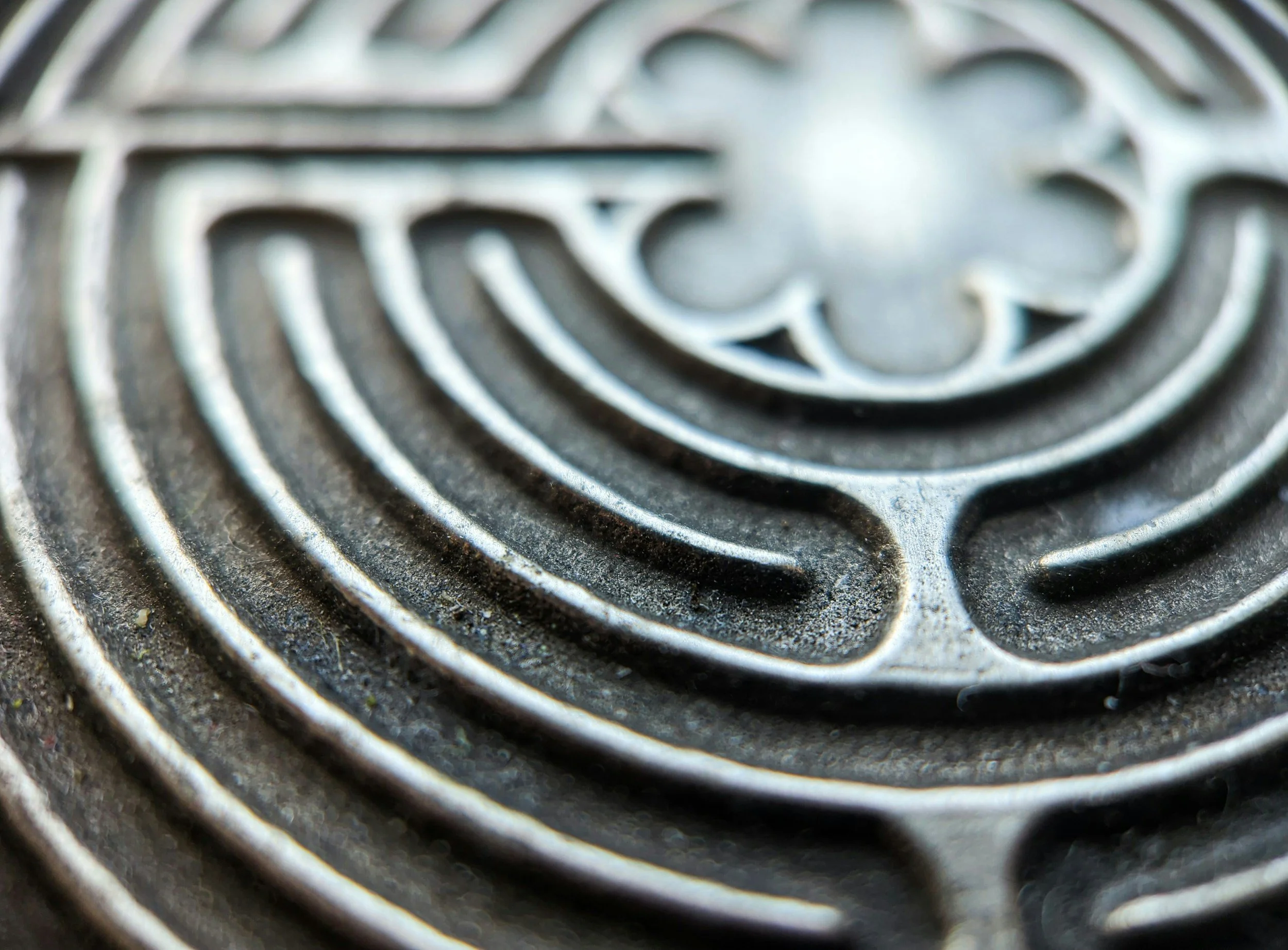 Close-up of a metal finger labyrinth used for prayer and meditation.