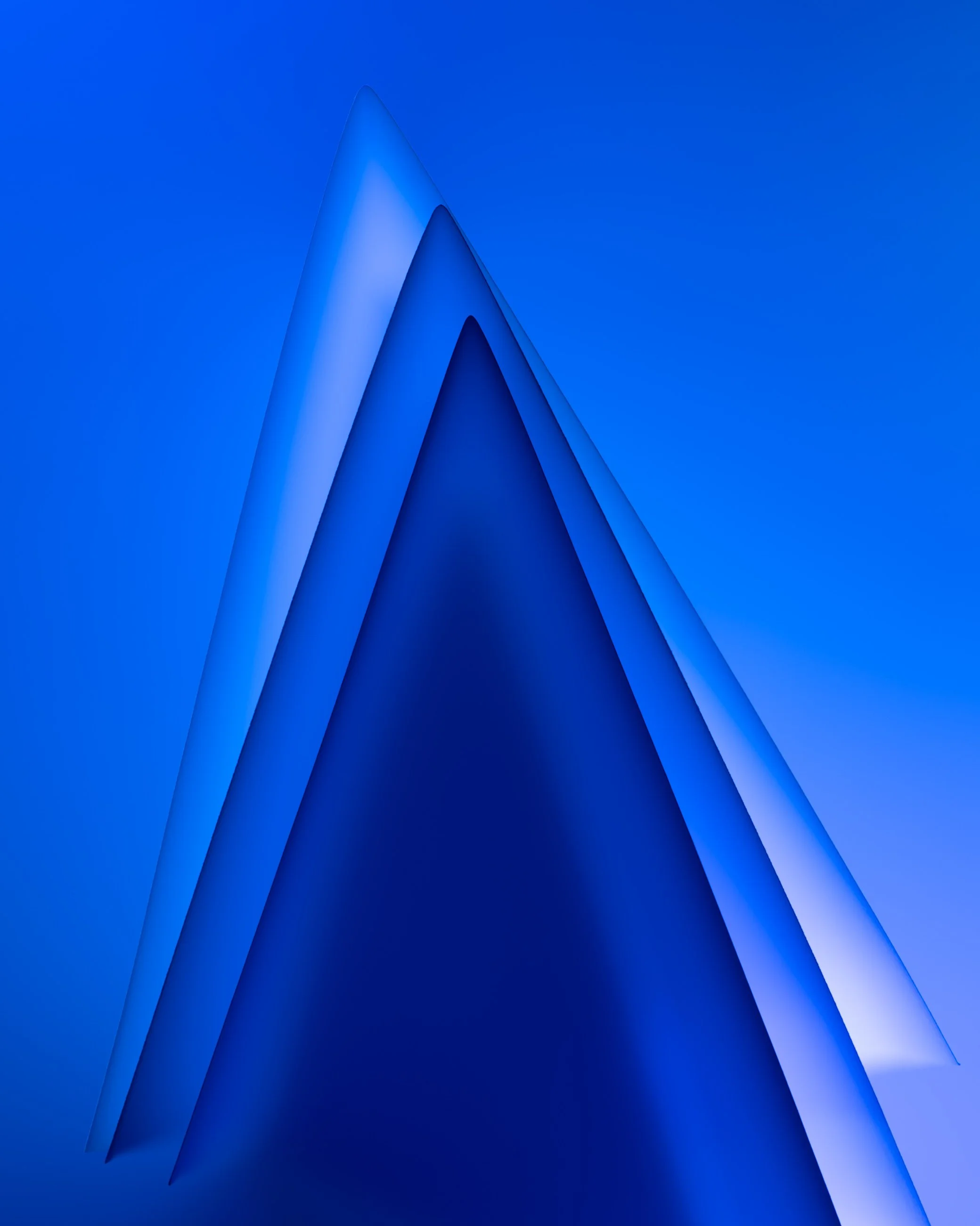 Abstract digital art with layered blue shapes forming a sharp peak or triangle.
