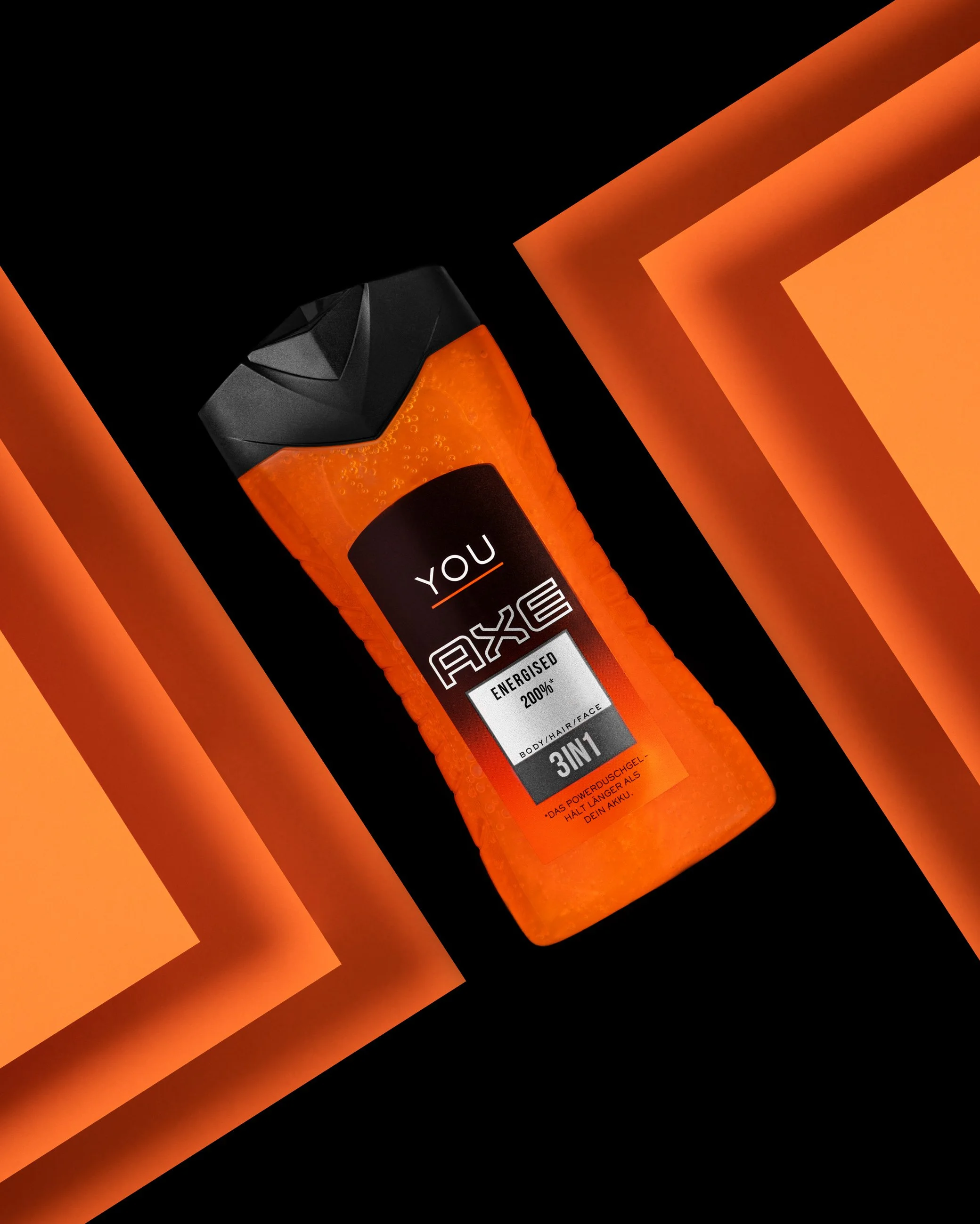 AXE body wash product photography with orange geometric background and bold lighting
