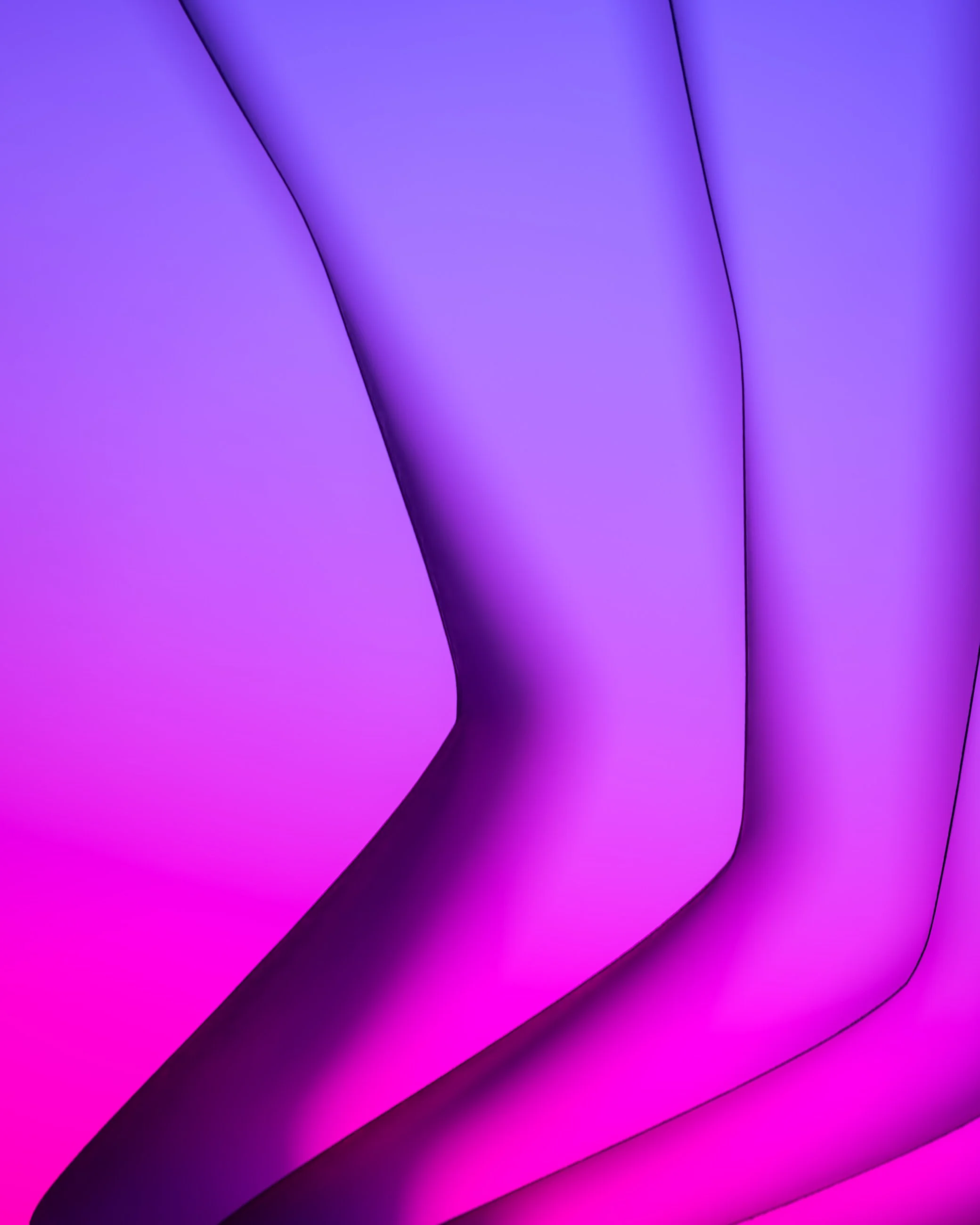 Close-up of an abstract design with purple and pink curved shapes and shadows.