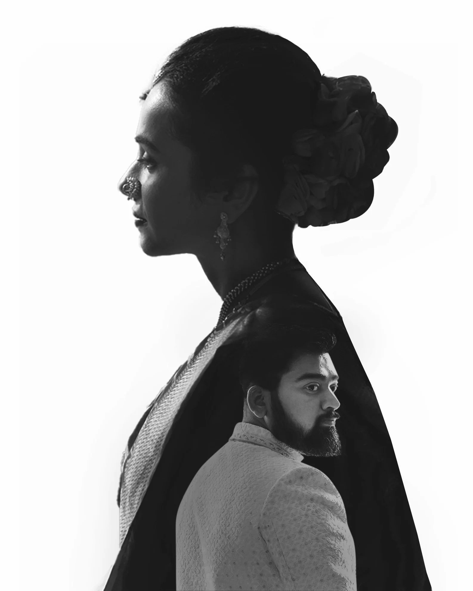 Black and white photo of a woman with traditional jewelry and a man in a suit, with the man's portrait blending into the woman's silhouette.