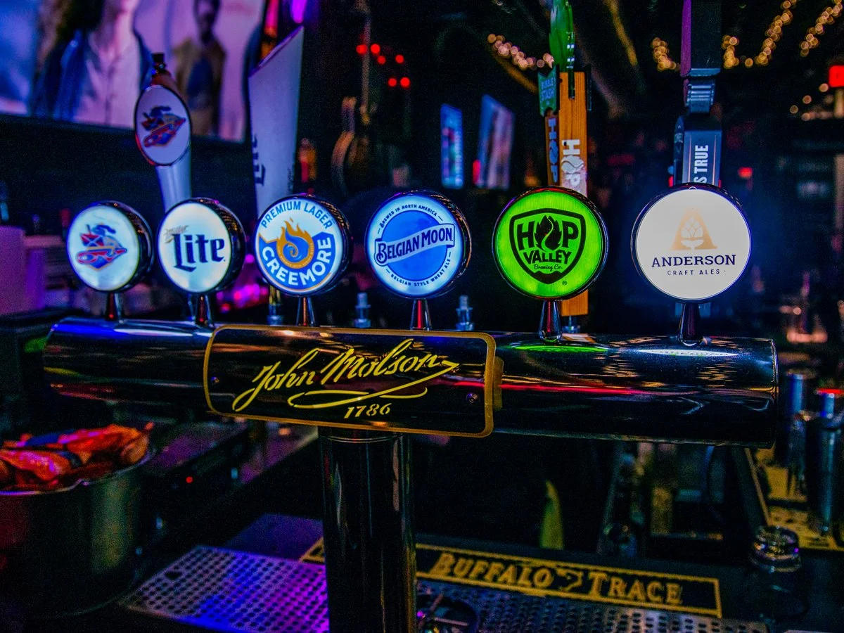 A beer tap system with six different beer brands.