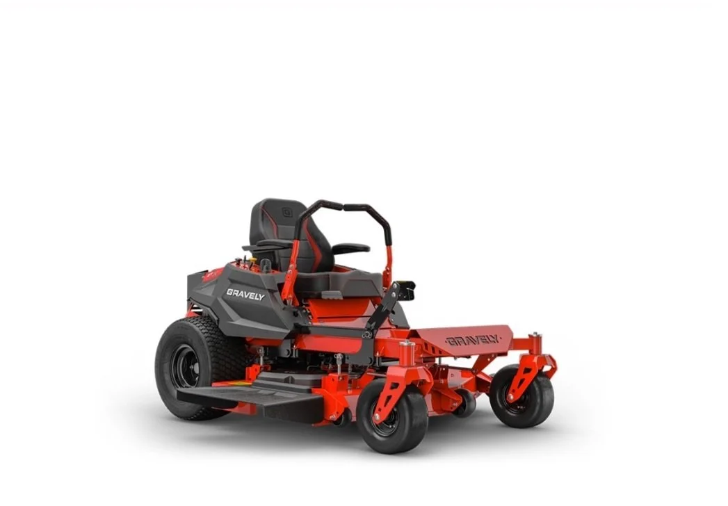 Red and black Gravely commercial mower with large rear tire, adjustable cutting deck, and operator seat.