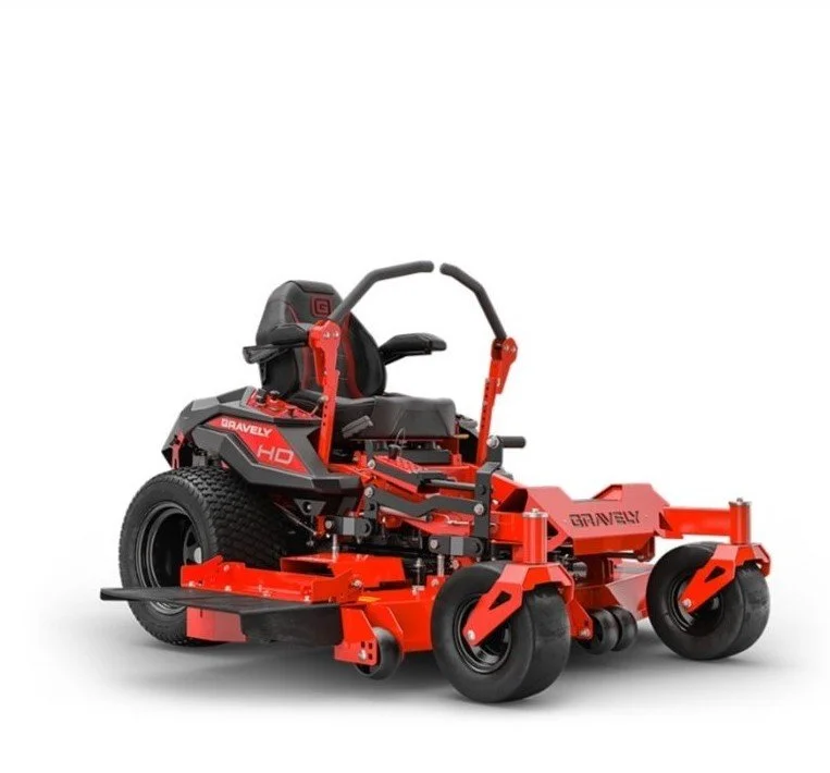 A red commercial lawn mower with a black seat and steering wheel, equipped with large rear wheels, designed for professional grass cutting.
