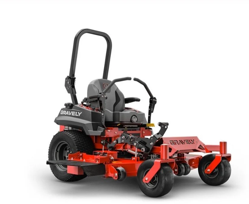 Red and black Gravely riding lawn mower with a seat, steering controls, and four black wheels.