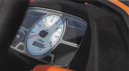 Close-up of a vehicle speedometer showing approximately 70 miles per hour.
