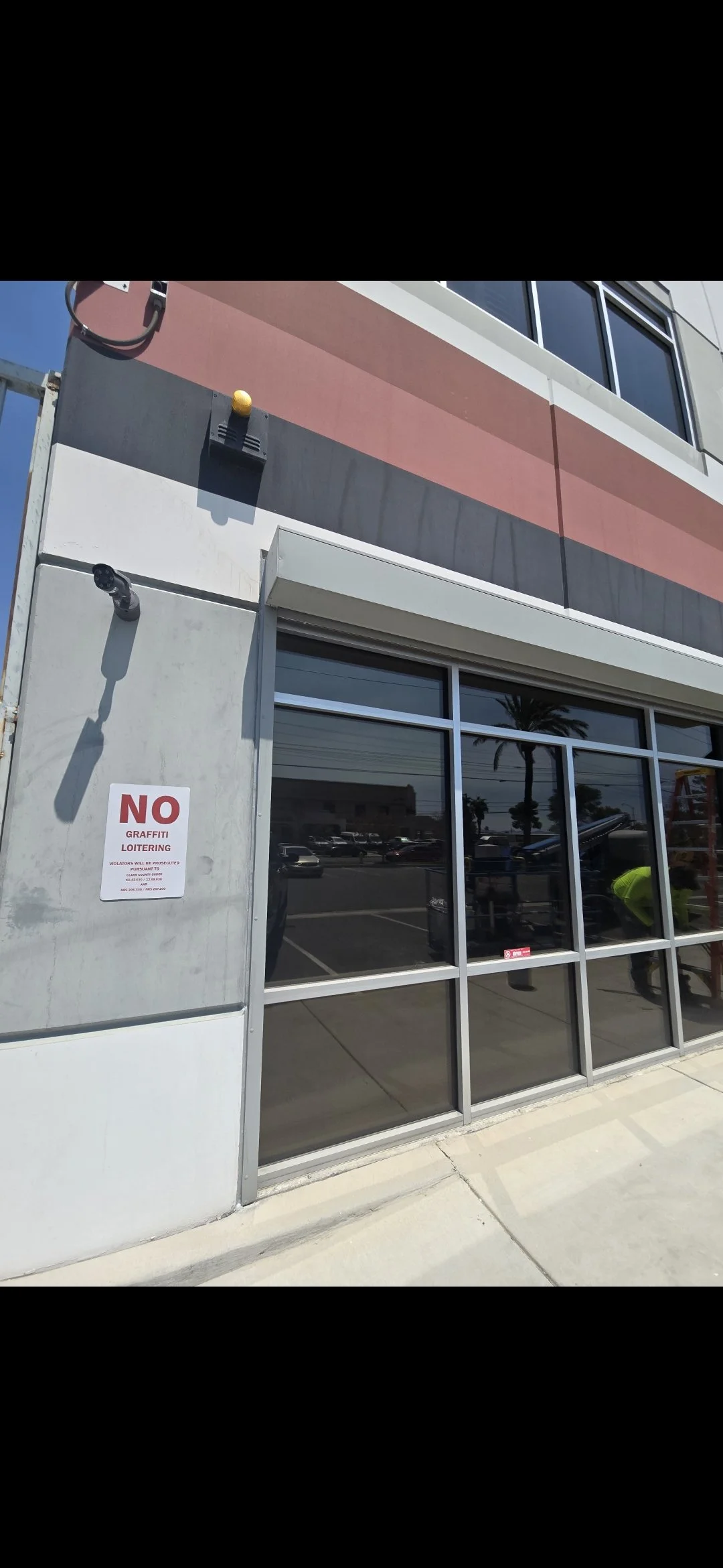 Glass storefront that had its window joints sealed with Sika Caulking