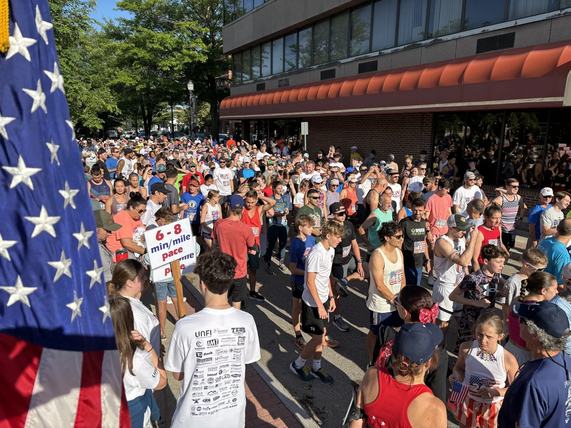 Critical to an organized race — volunteer sign holders!
