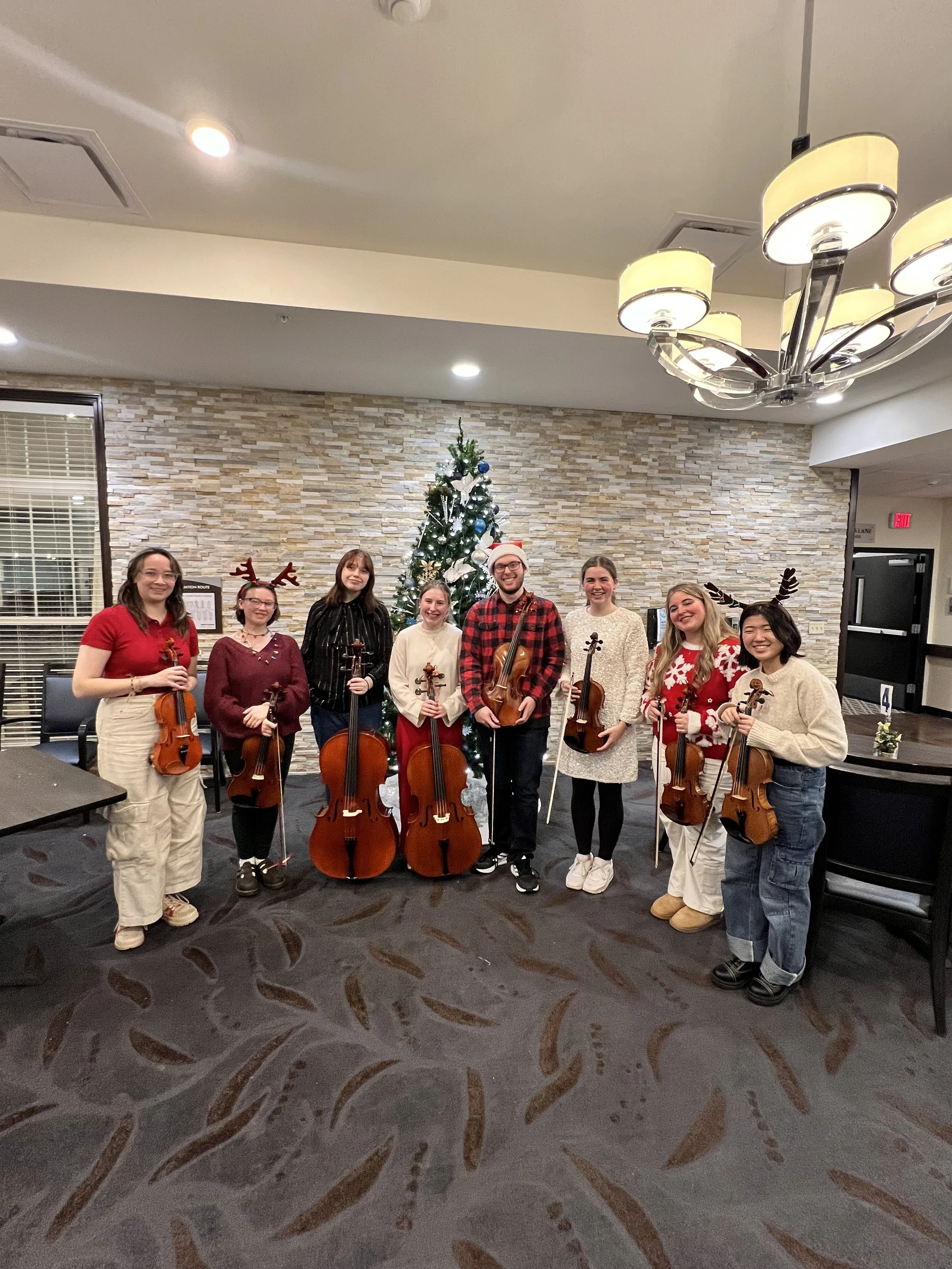String octet performing Christmas music at The Oaks in Byron Center nursing home.