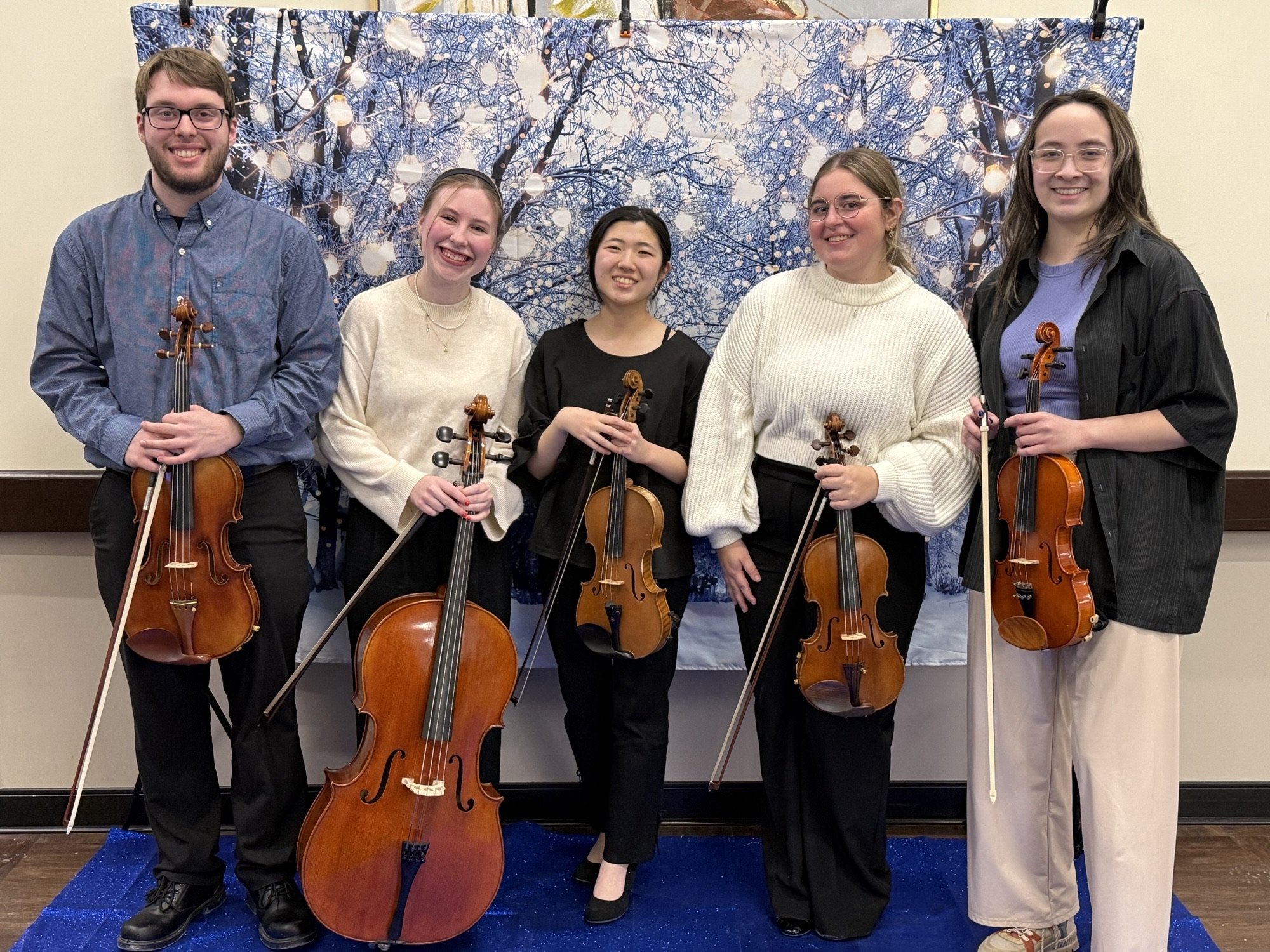 String octet performing dinner music at The Oaks in Byron Center nursing home for a winter ball event.
