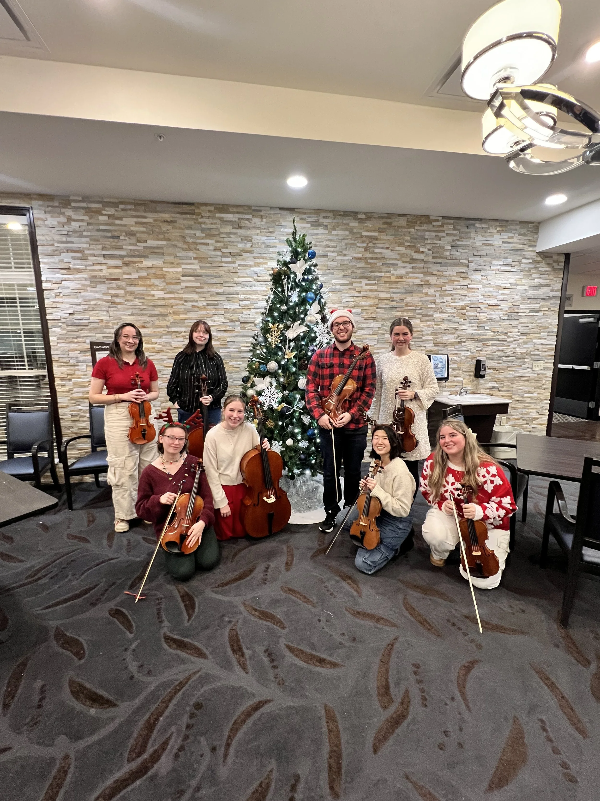 String octet performing Christmas music at The Oaks in Byron Center nursing home.