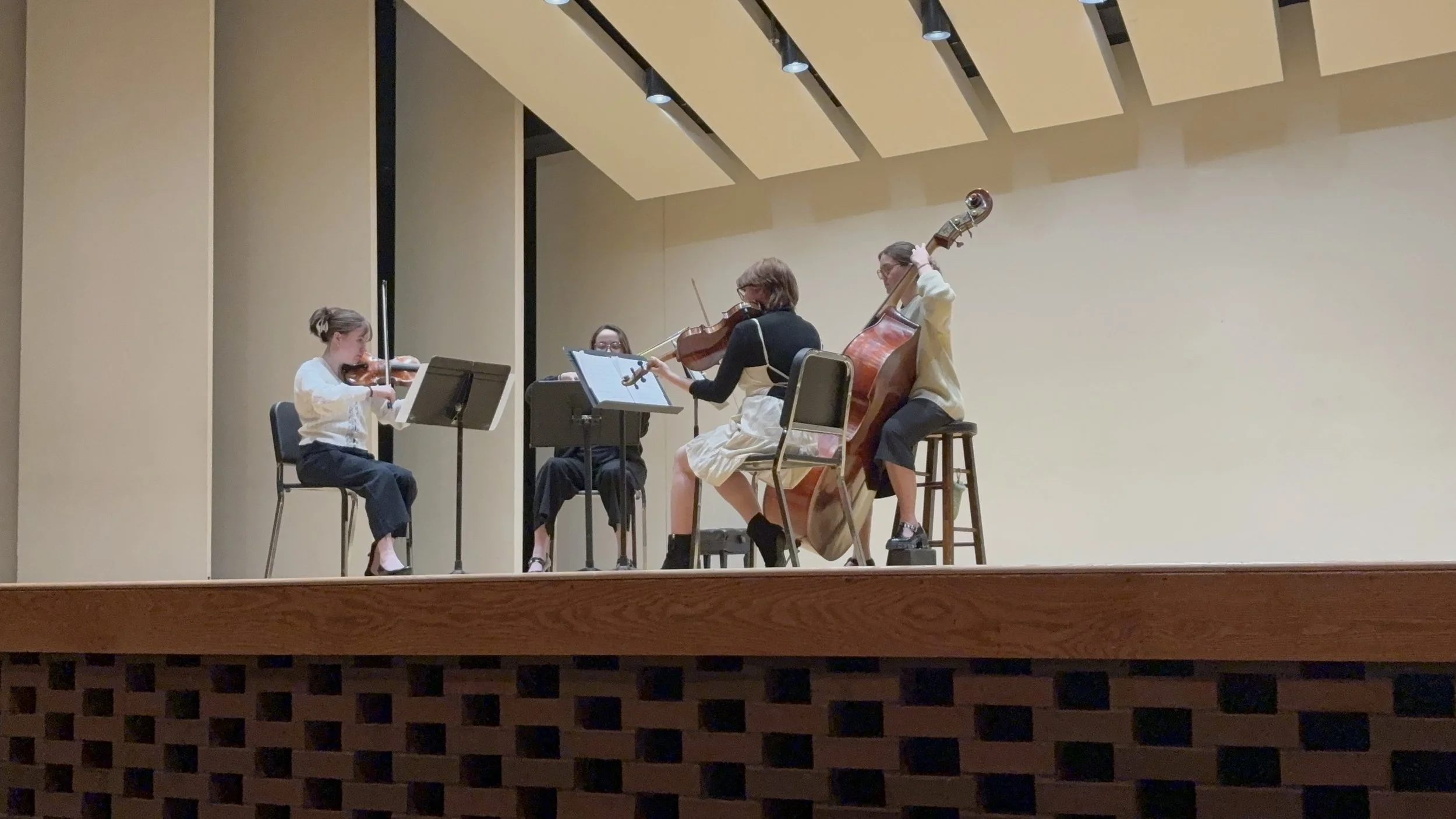 “The Board String Quartet” performing in a master class for the Varo String Quartet at WMU.